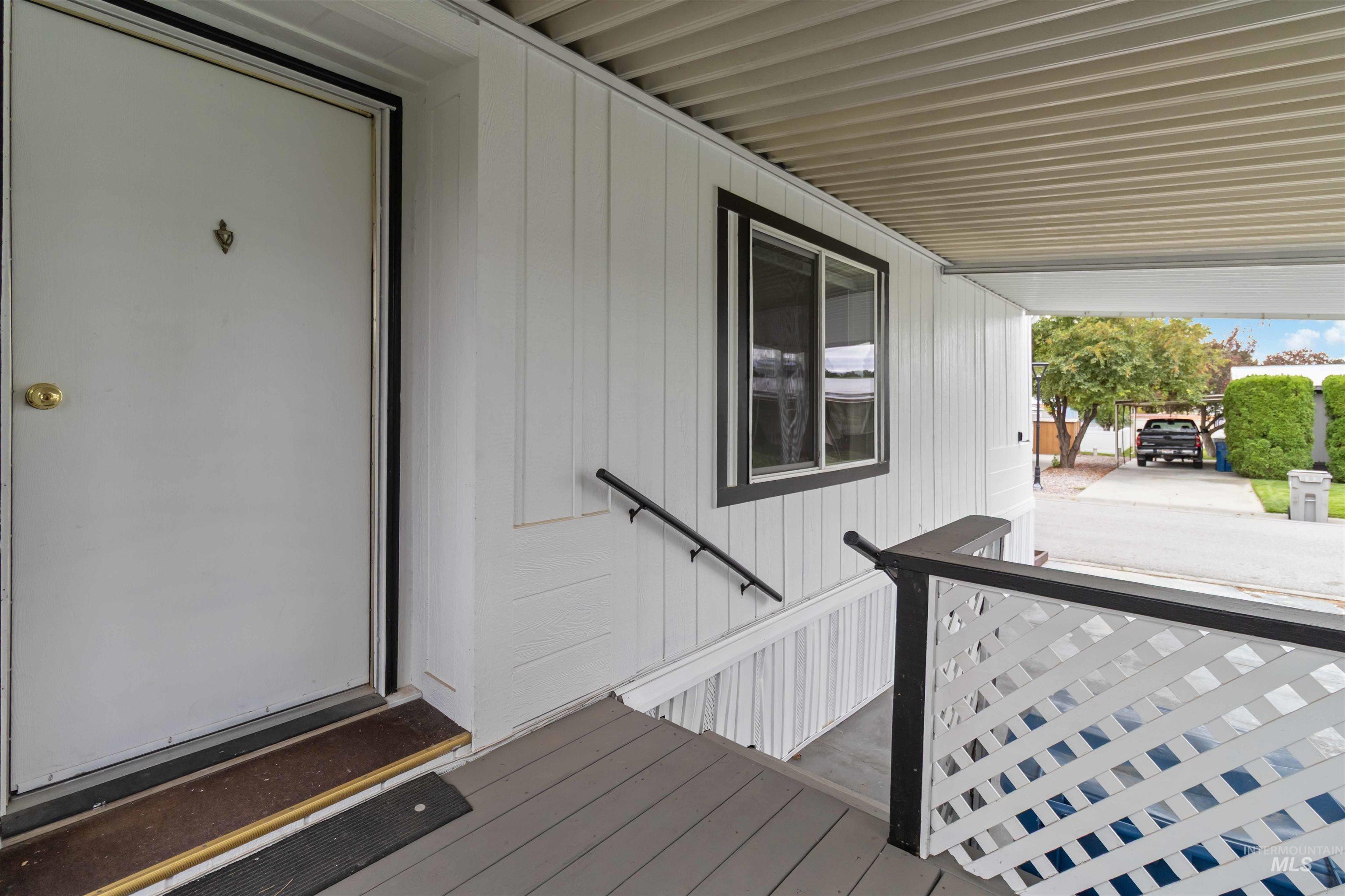 Property entrance with covered porch