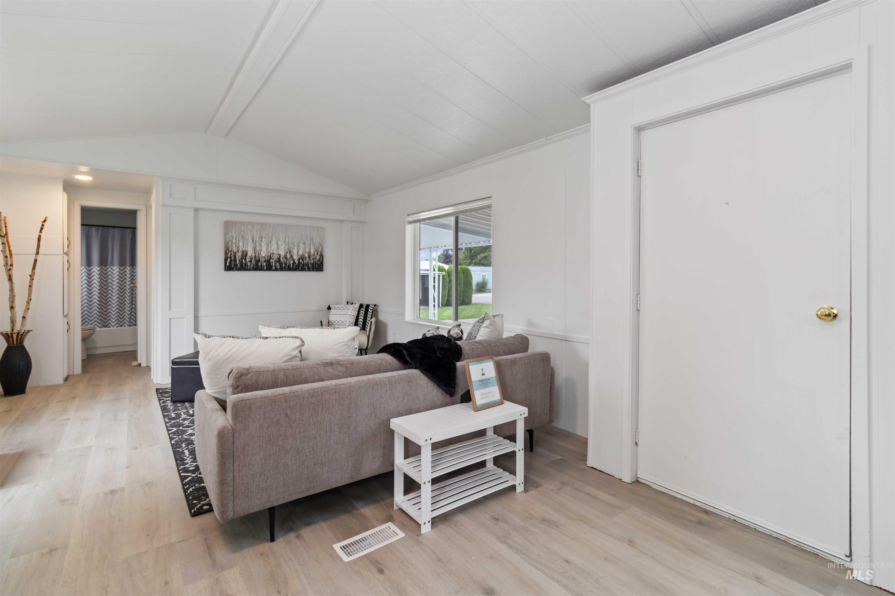 Living room with light wood-style floors