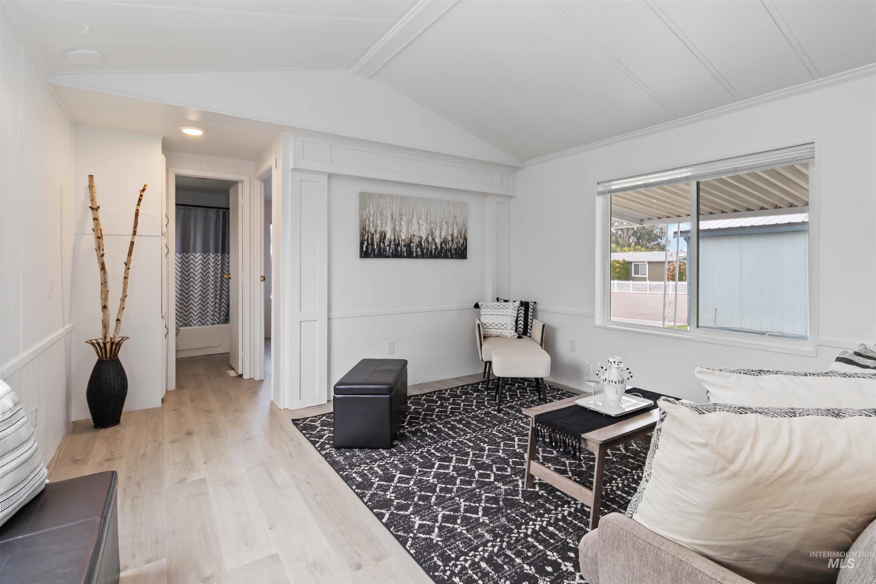 Living area with light wood-style floors