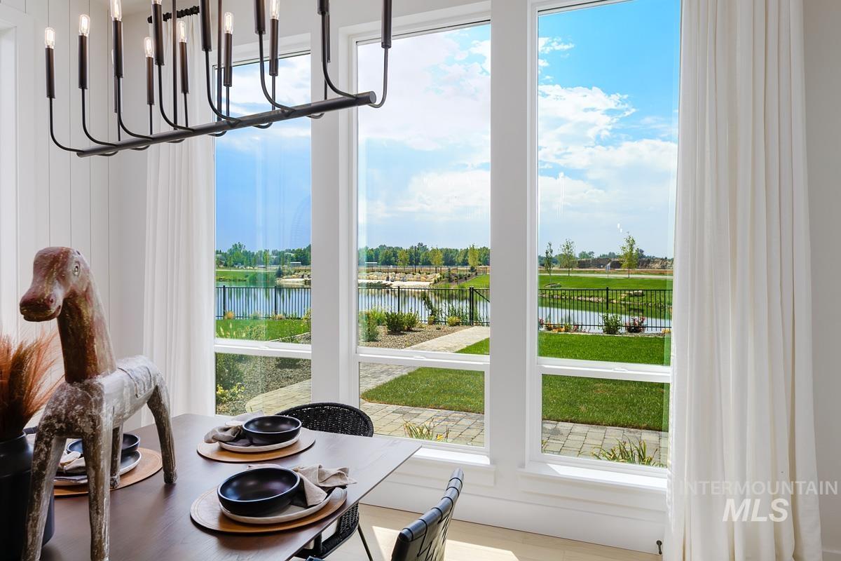 Doorway featuring a chandelier and a water view