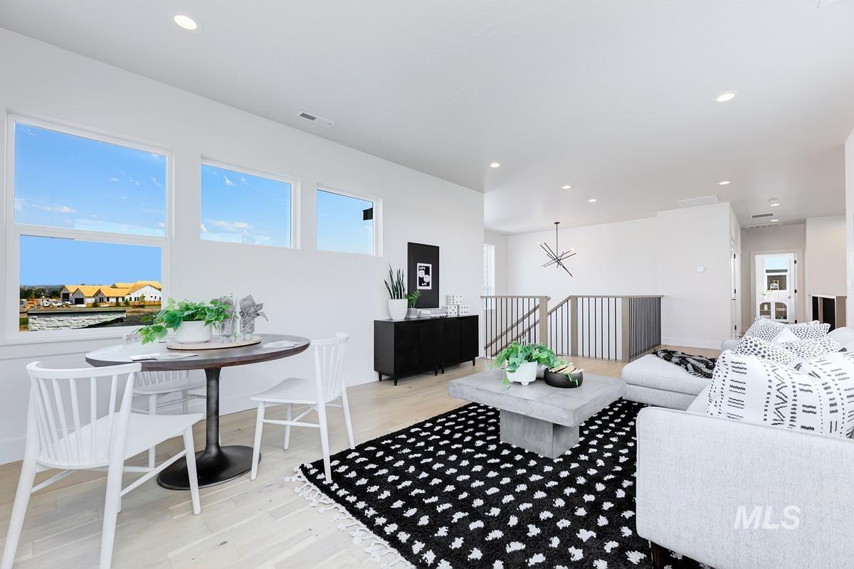 Living area featuring light wood-type flooring and recessed lighting