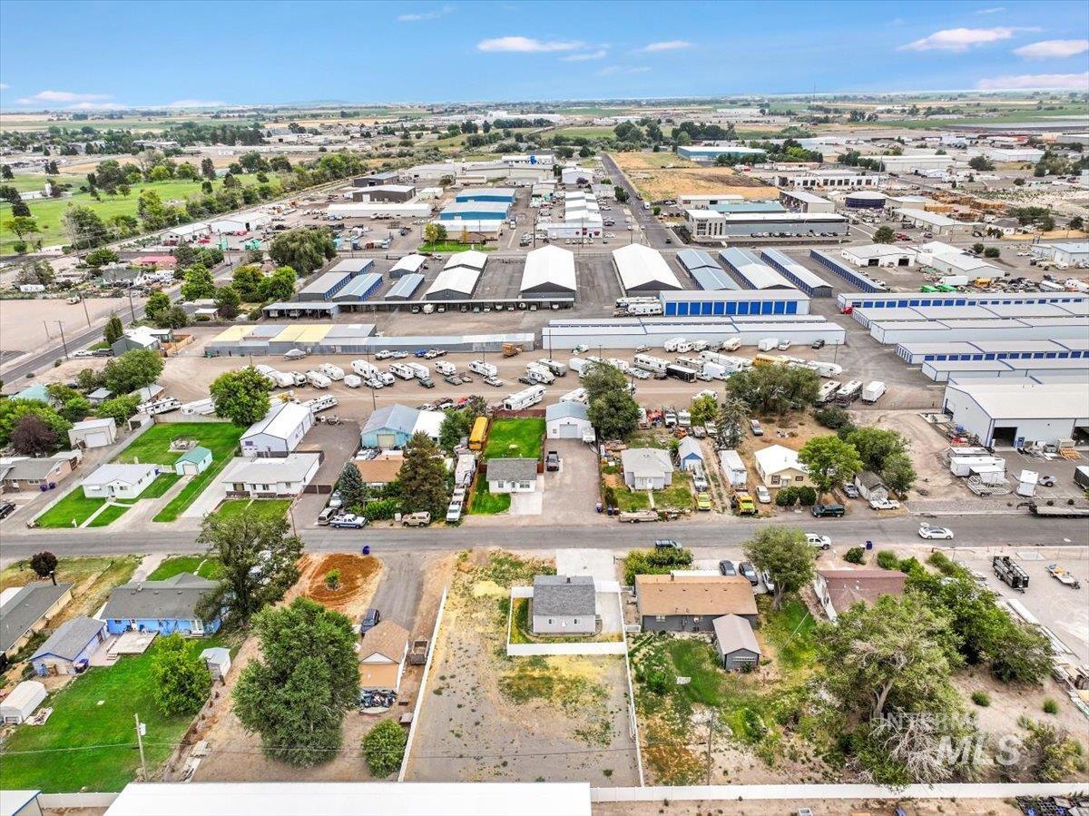 Aerial view of property's location with an industrial area