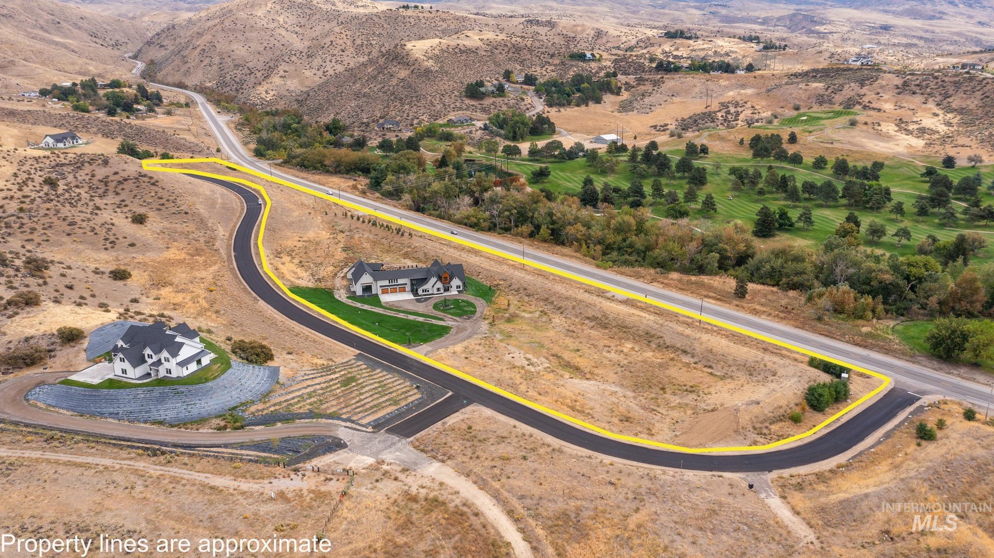 Aerial overview of property's location with property boundaries highlighted and rural landscape