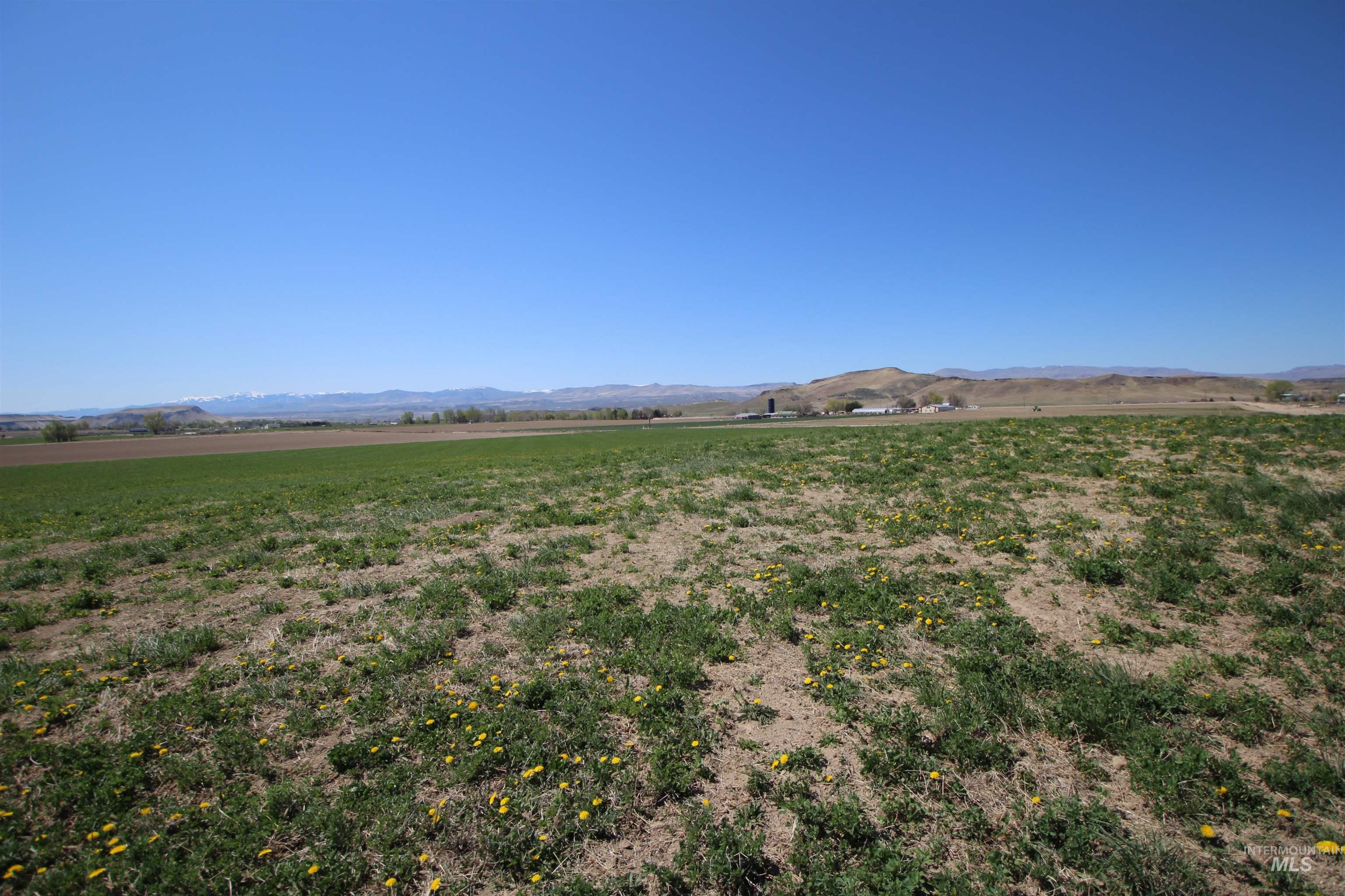 View of mountain backdrop featuring rural landscape