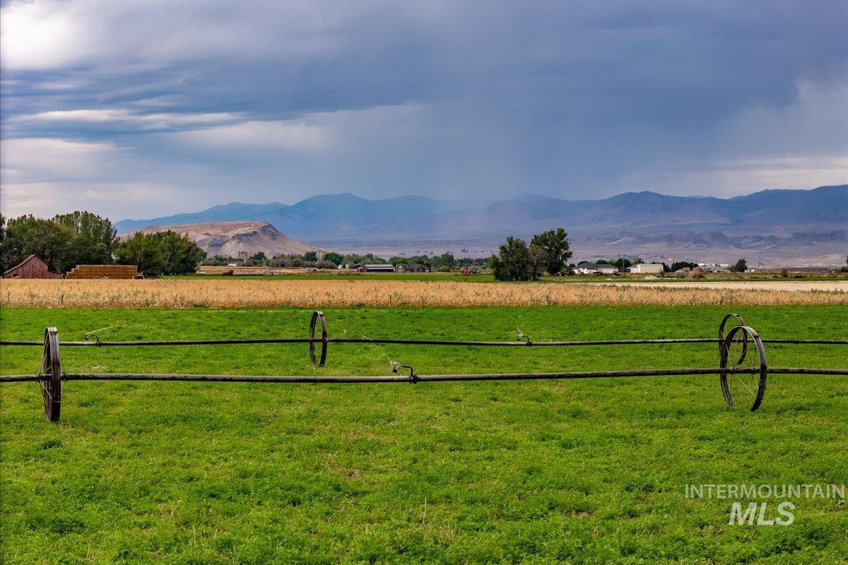 View of mountain backdrop featuring rural landscape