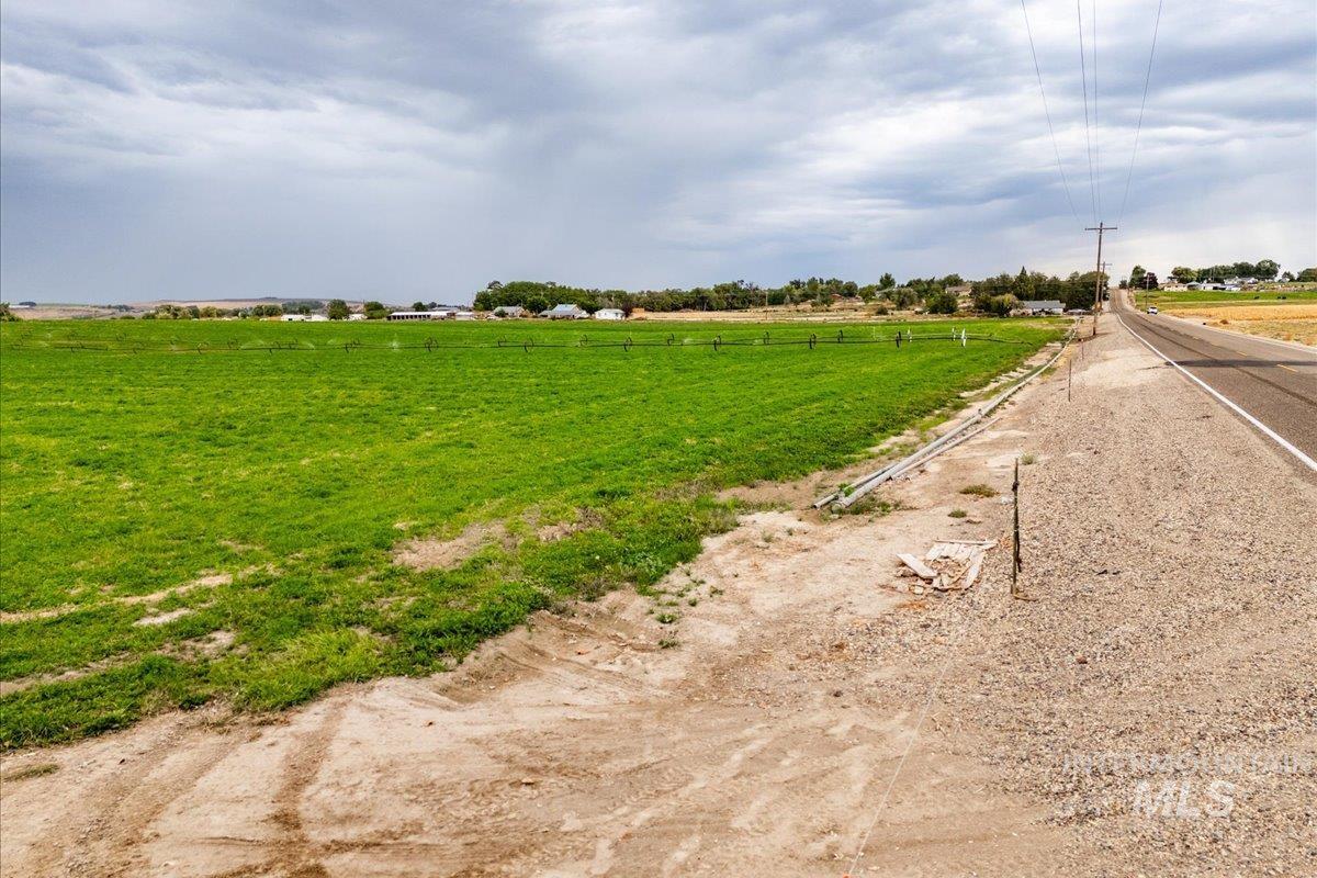 View of asphalt road with a rural view