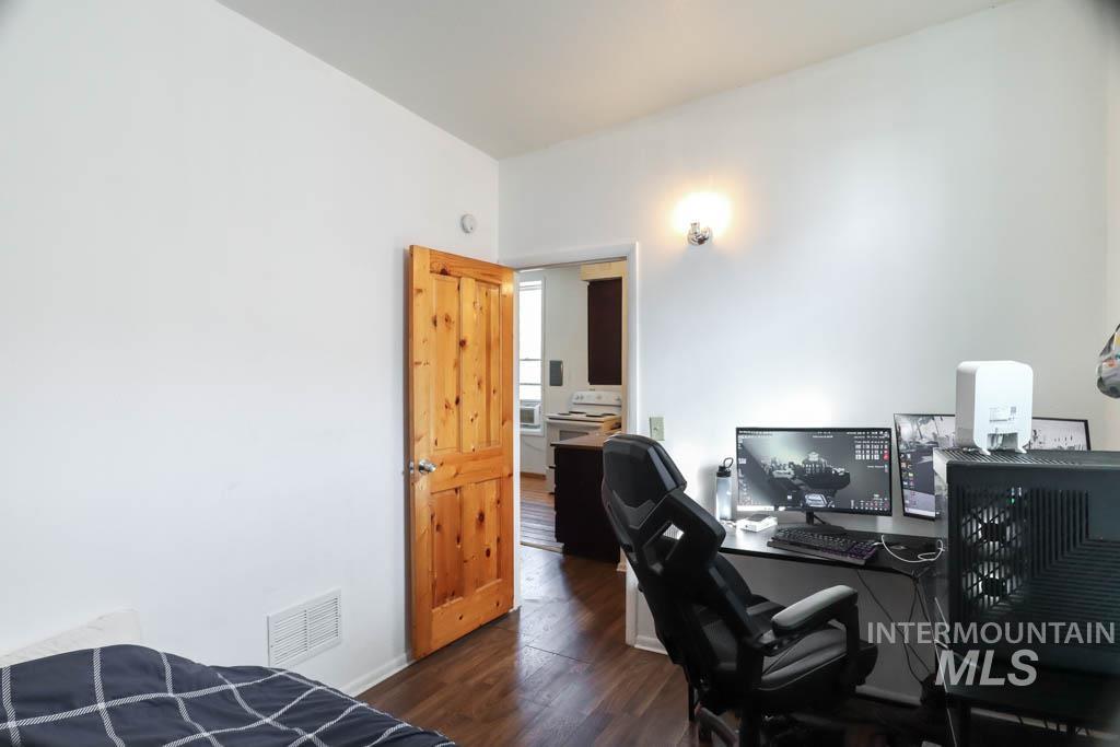 Office space featuring dark wood finished floors