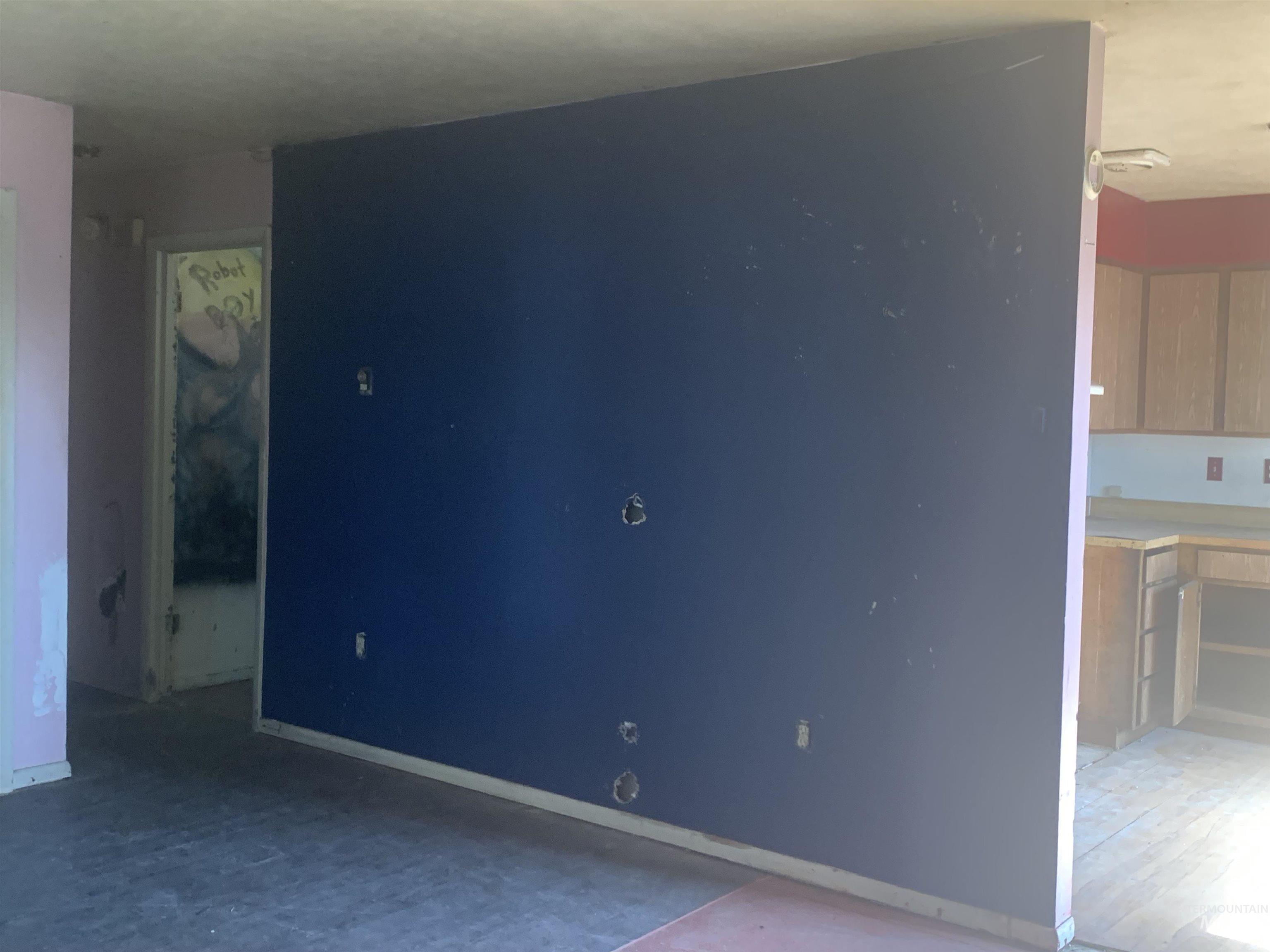 Unfurnished room with baseboards