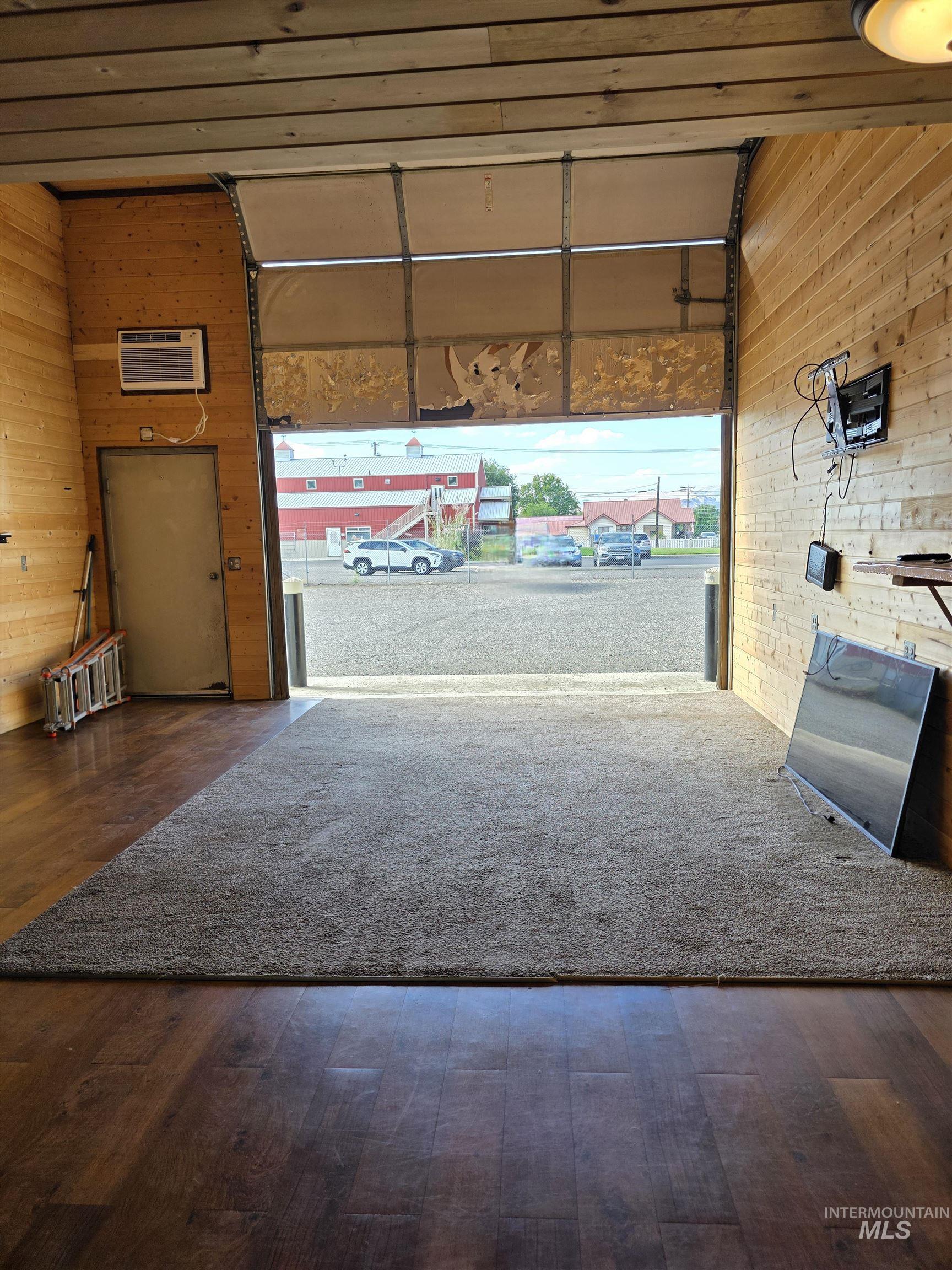 Garage with wooden walls and a wall unit AC