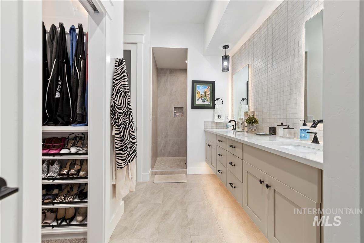 Primary suite on the main level. Walk in shower; floating dual vanity; direct access to custom closet and laundry room