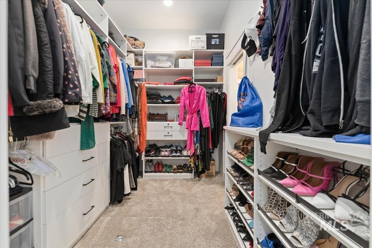Custom California closet with shoe racks, scarf hangers, drawers and shelving.