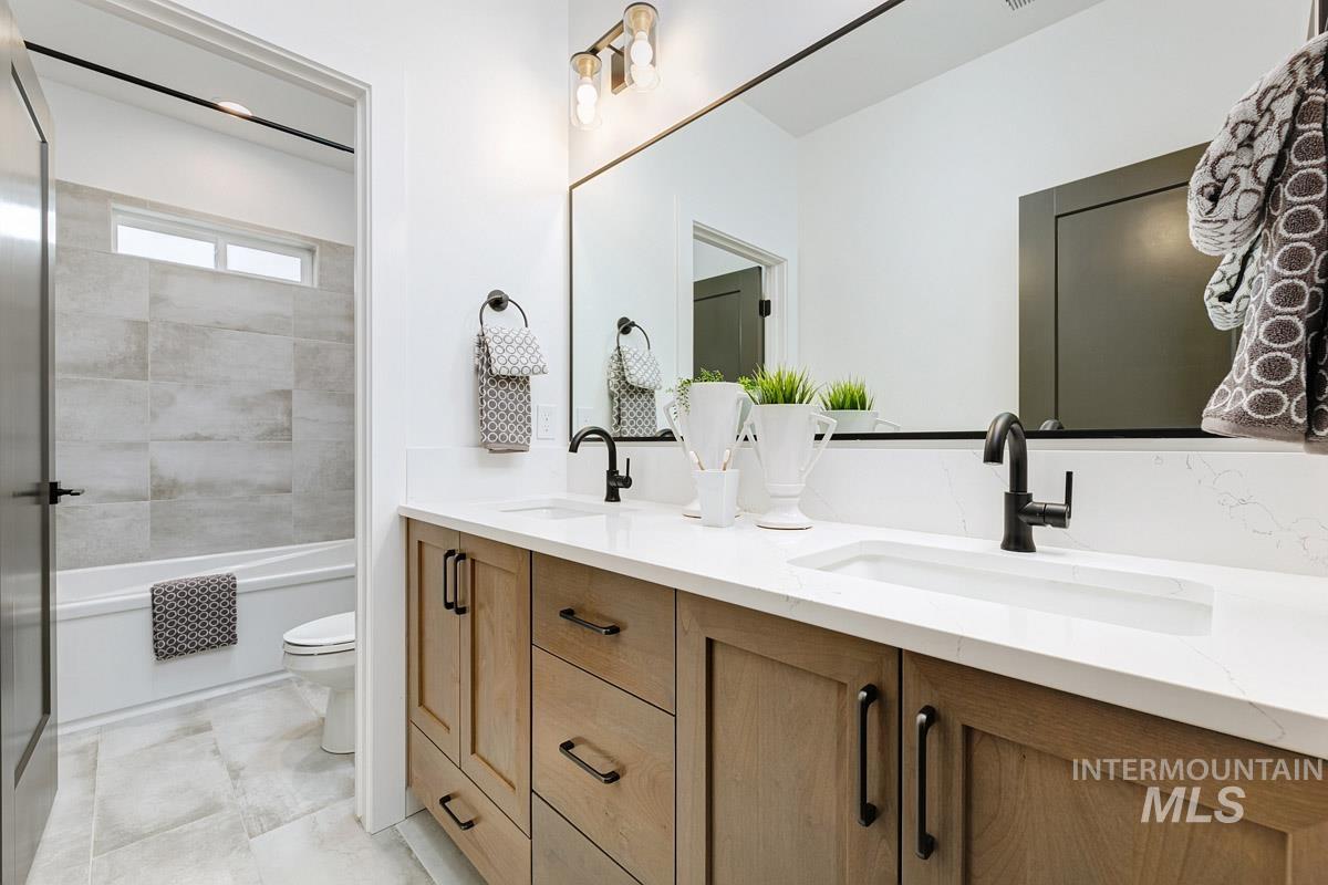 Bathroom with double vanity and  shower combination