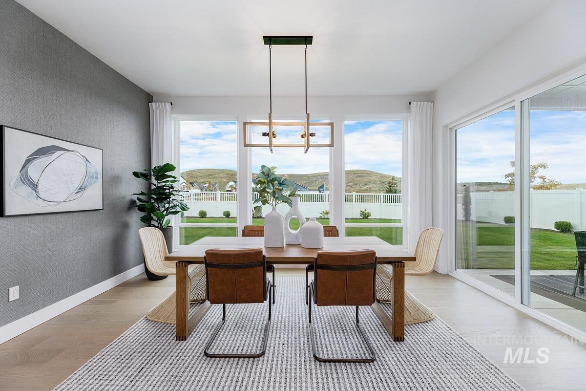 Sunroom / solarium with a chandelier