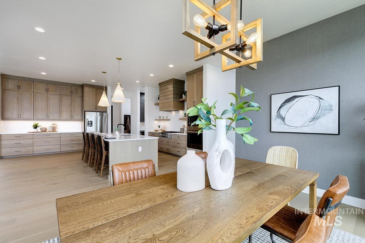 Dining space featuring light wood-style floors and recessed lighting