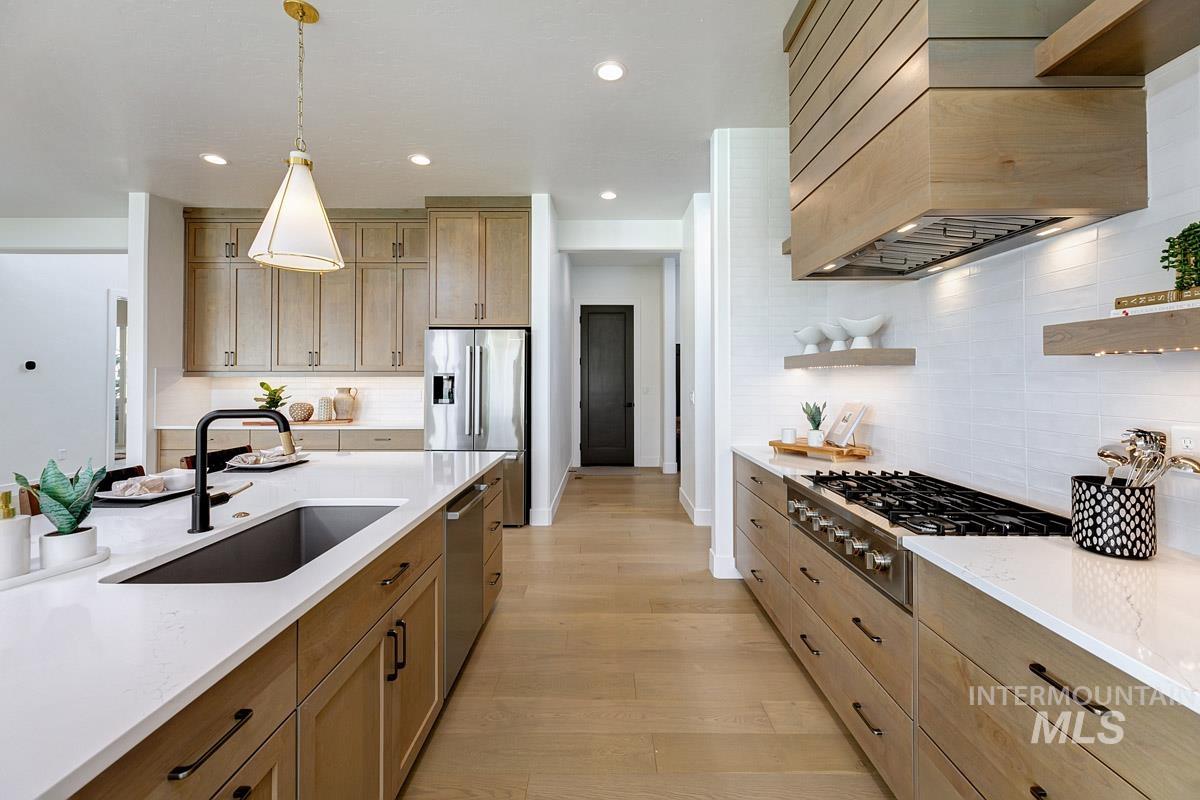 Kitchen with open shelves, pendant lighting, decorative backsplash, recessed lighting, and light wood-style flooring