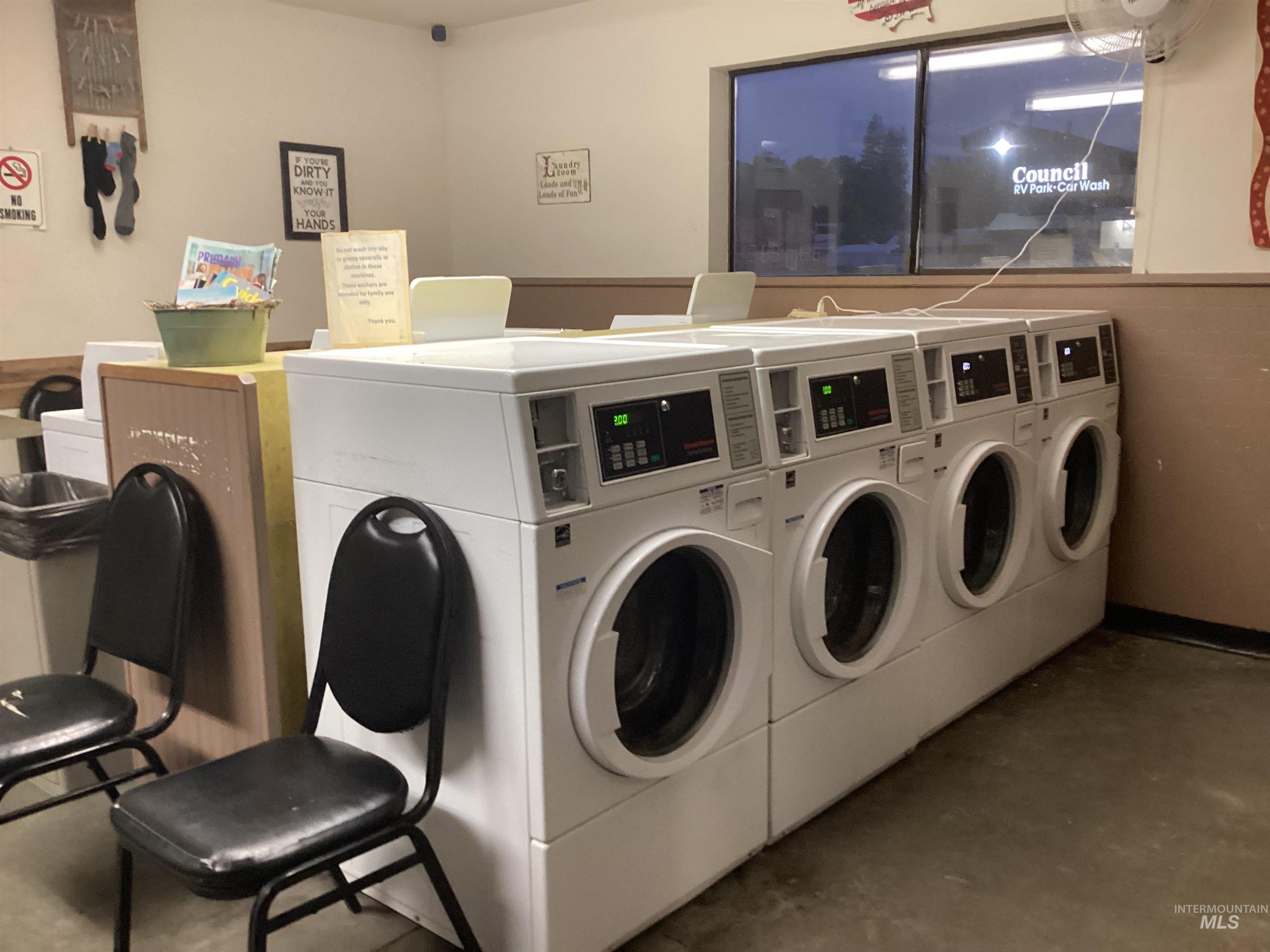 Shared laundry featuring separate washer and dryer