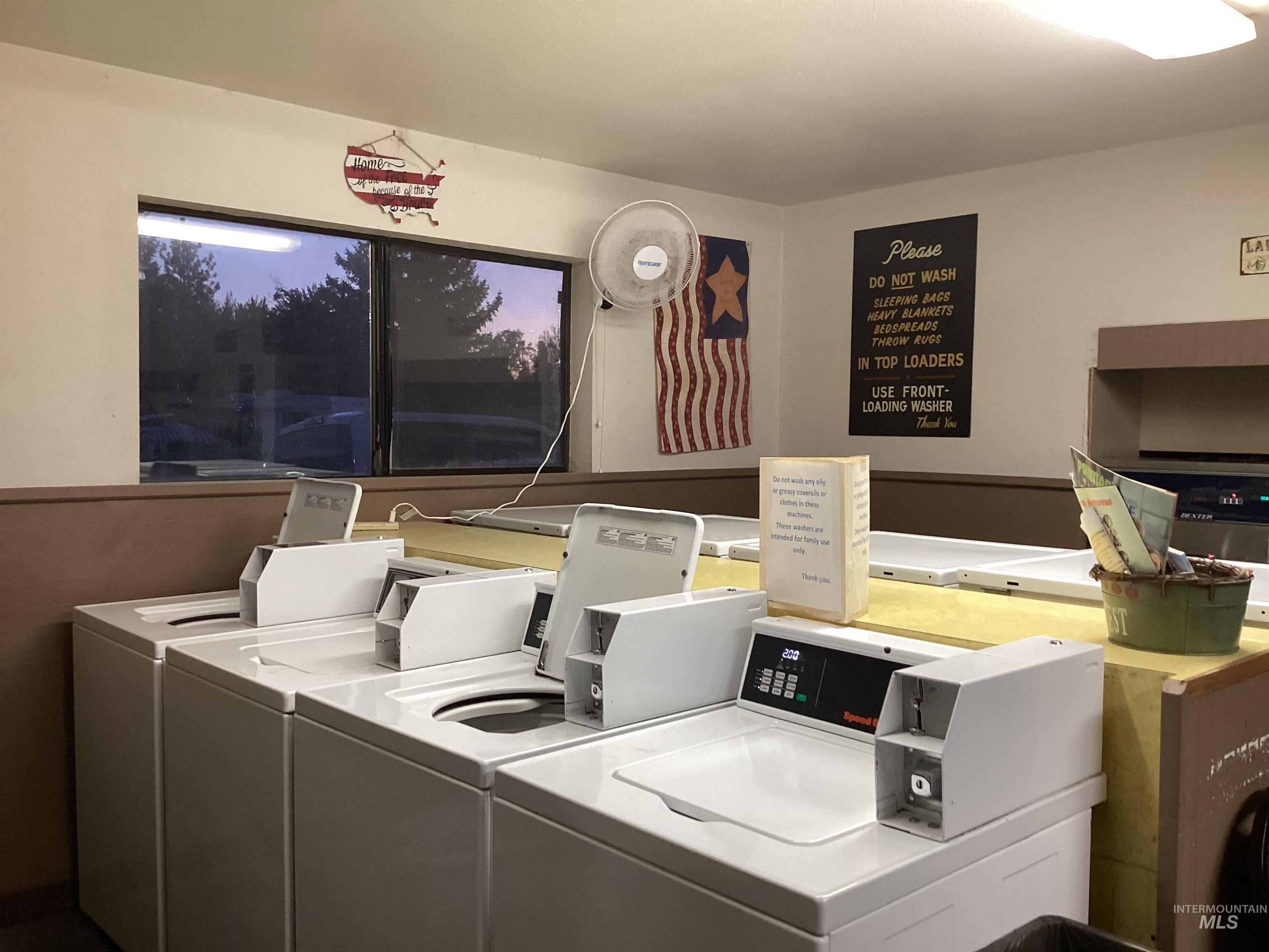 Laundry room featuring separate washer and dryer