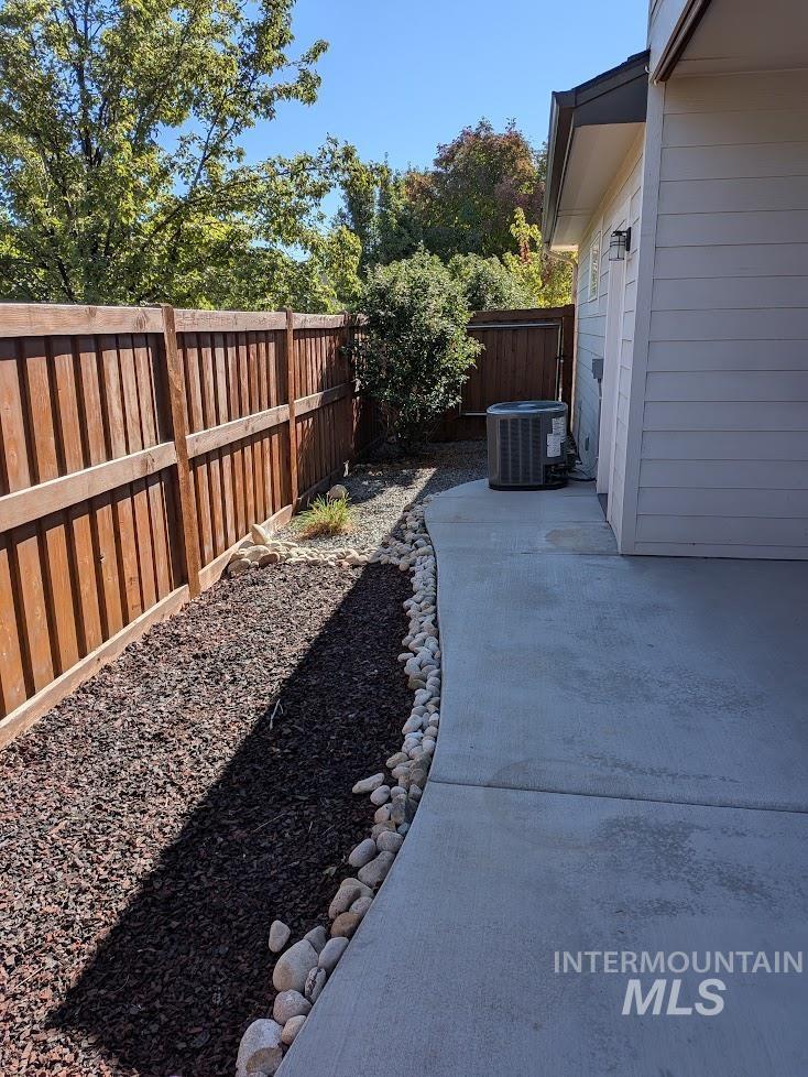 Fenced backyard featuring a patio