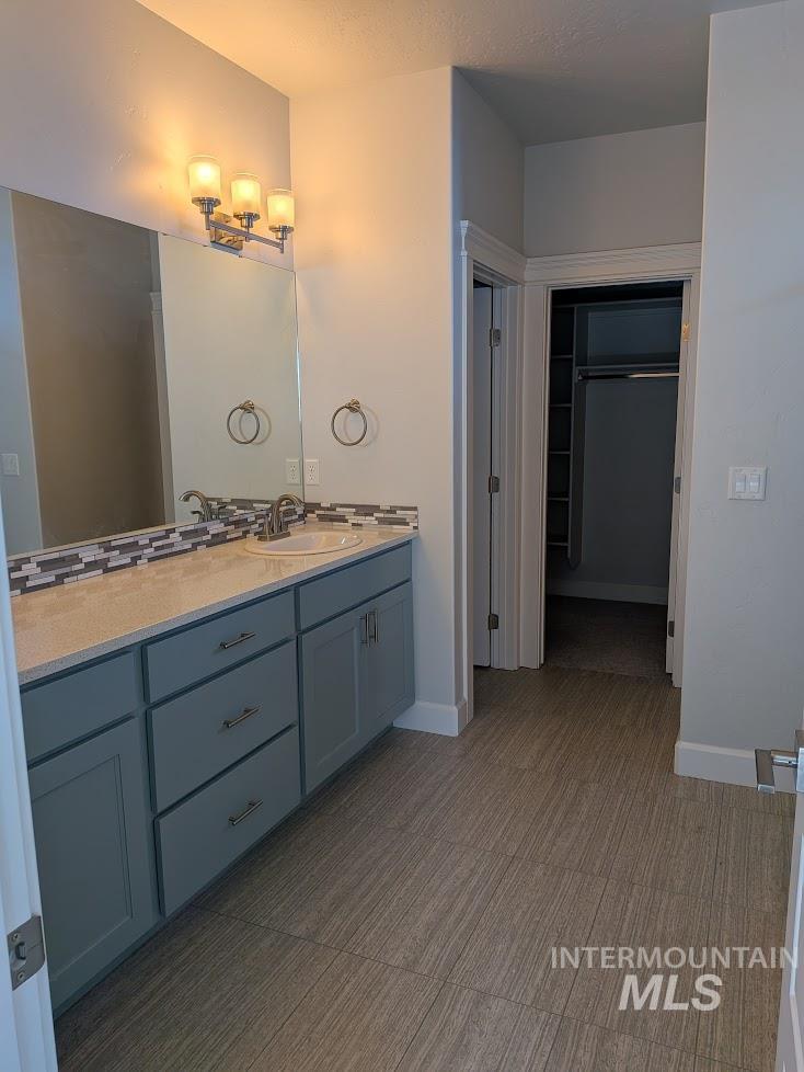 Master Bathroom with vanity and a closet