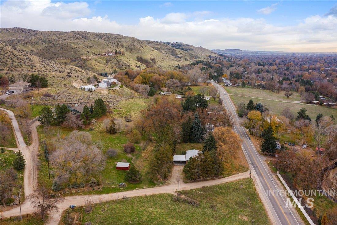 Aerial view of property's location with a mountainous background