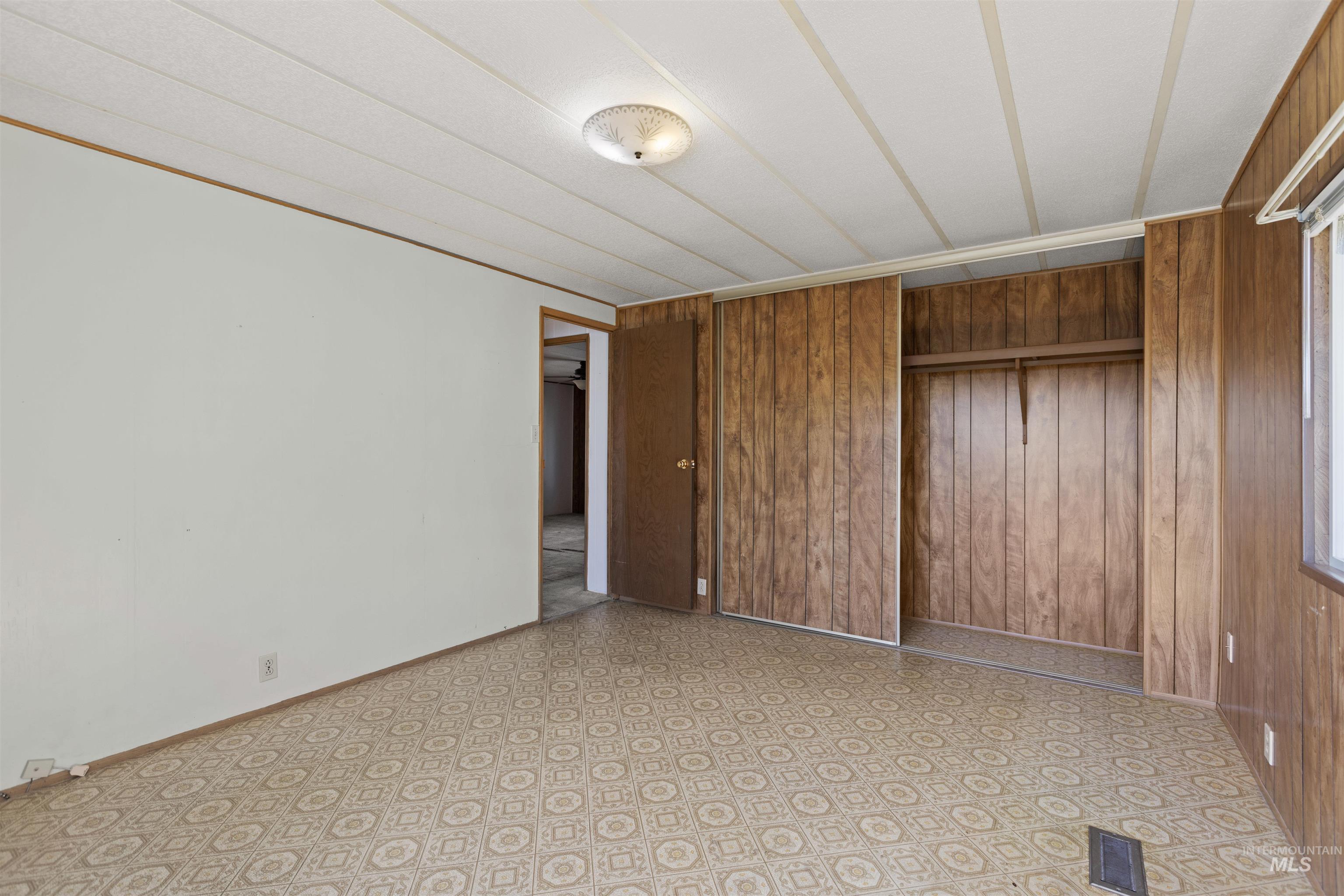 Empty room with wooden walls