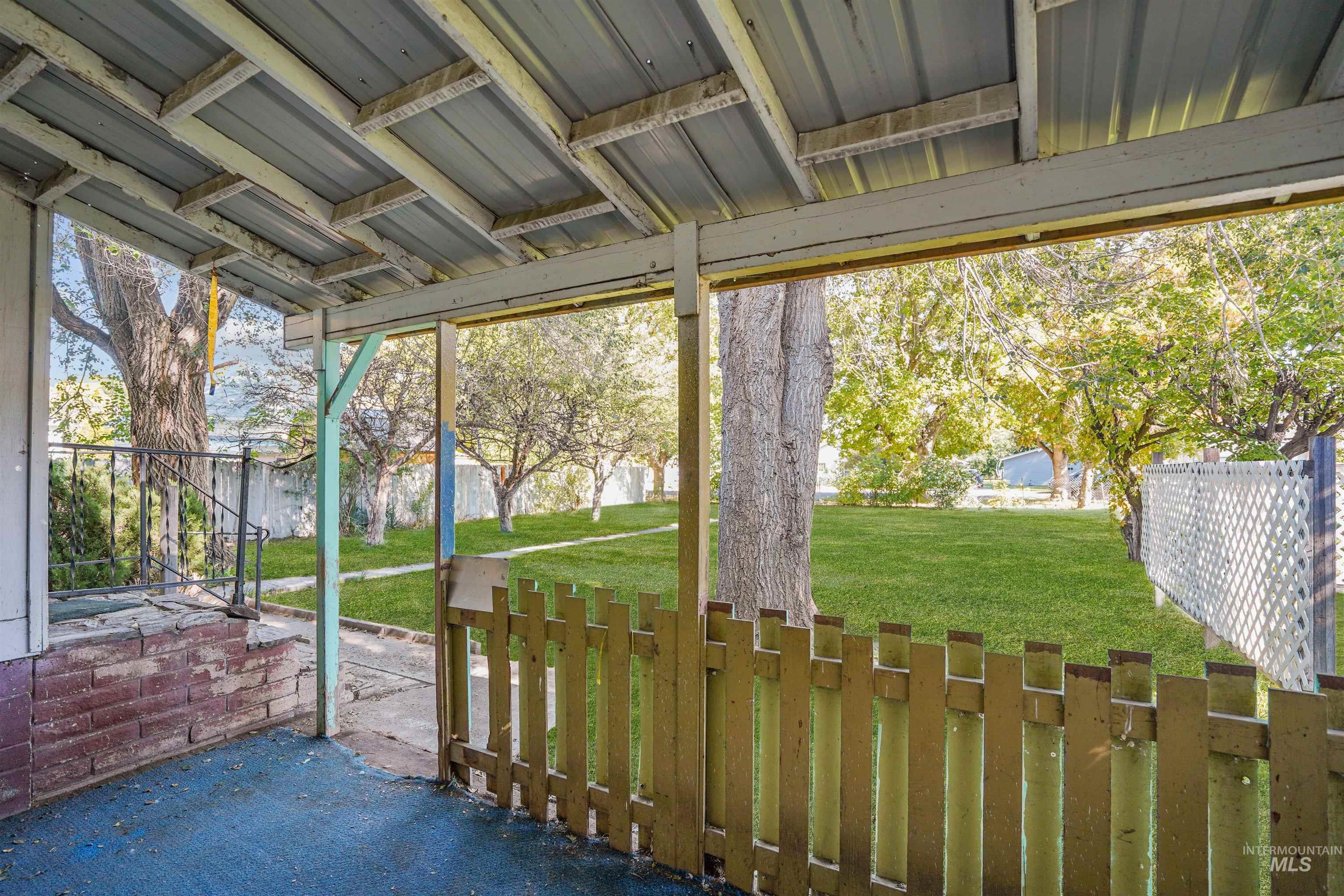 Fenced backyard featuring a patio
