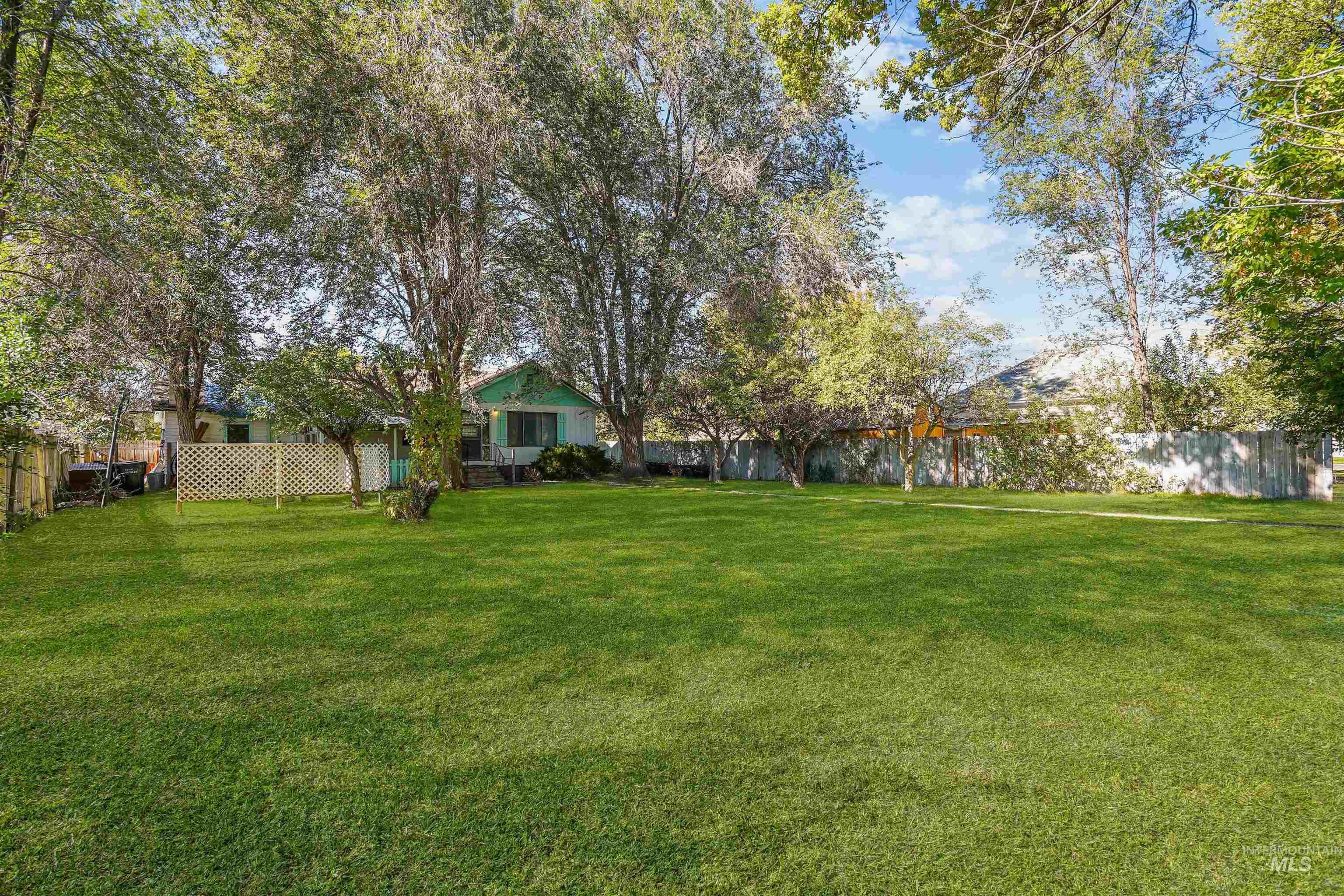 View of fenced backyard
