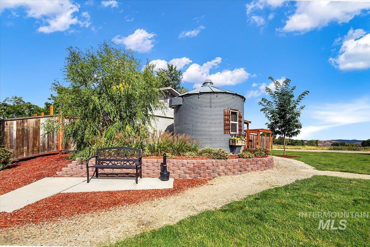 View of home's community featuring a lawn and a gazebo