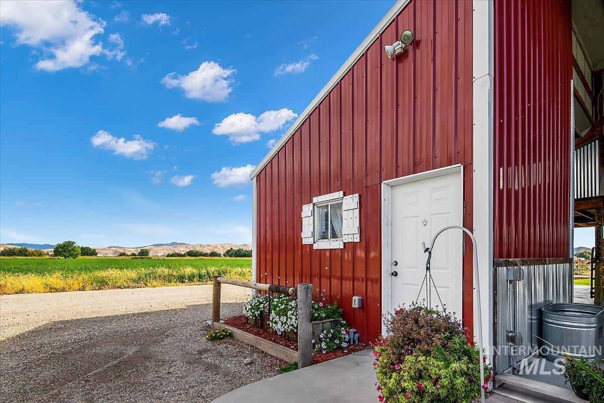 View of outbuilding with a mountain view and a view of countryside