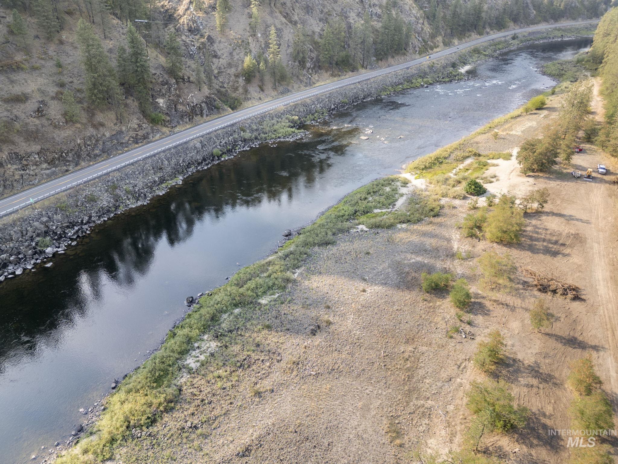 Aerial view of property and surrounding area featuring a large body of water
