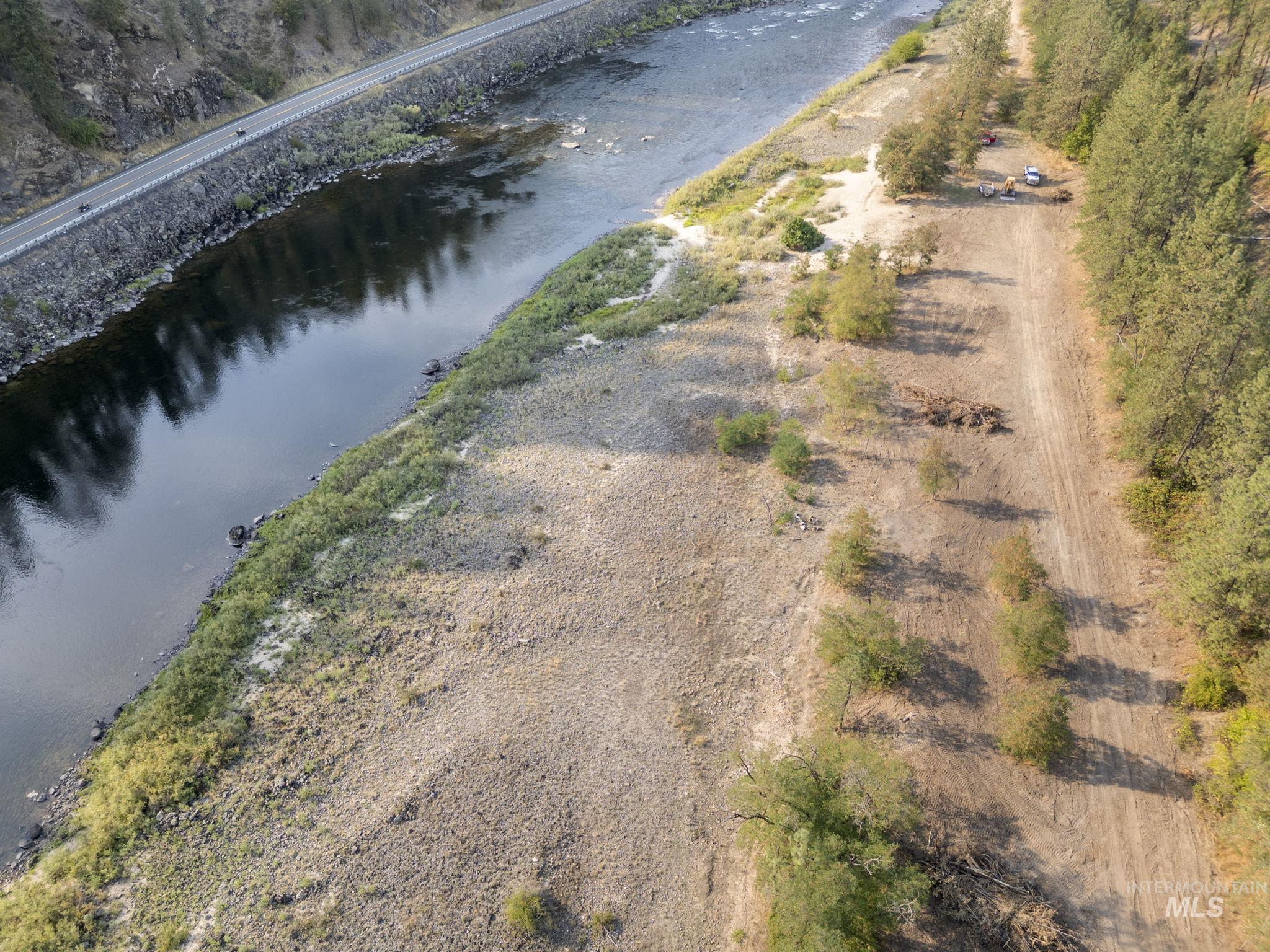Aerial overview of property's location with a large body of water