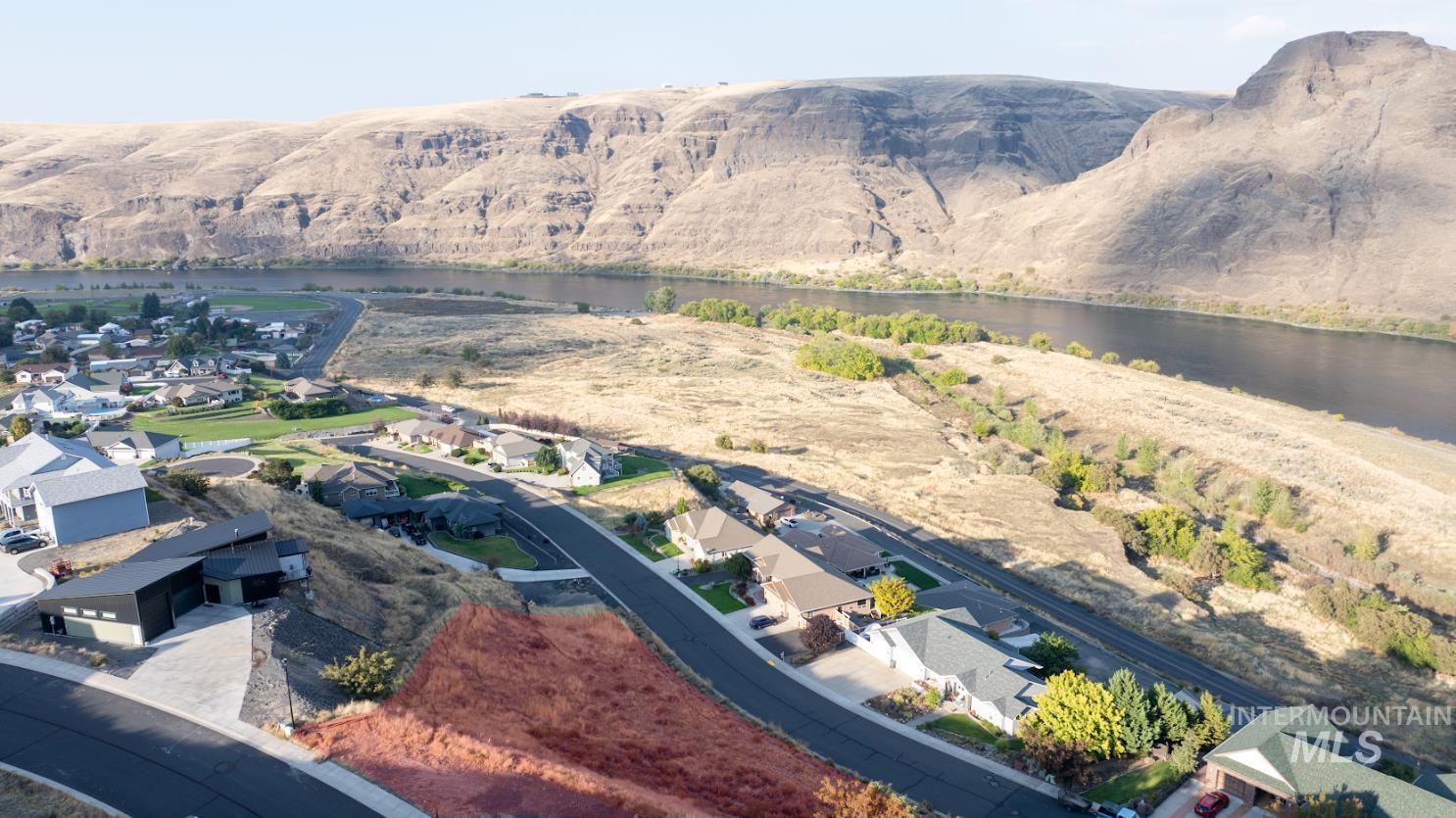 Aerial view of residential area featuring a large body of water