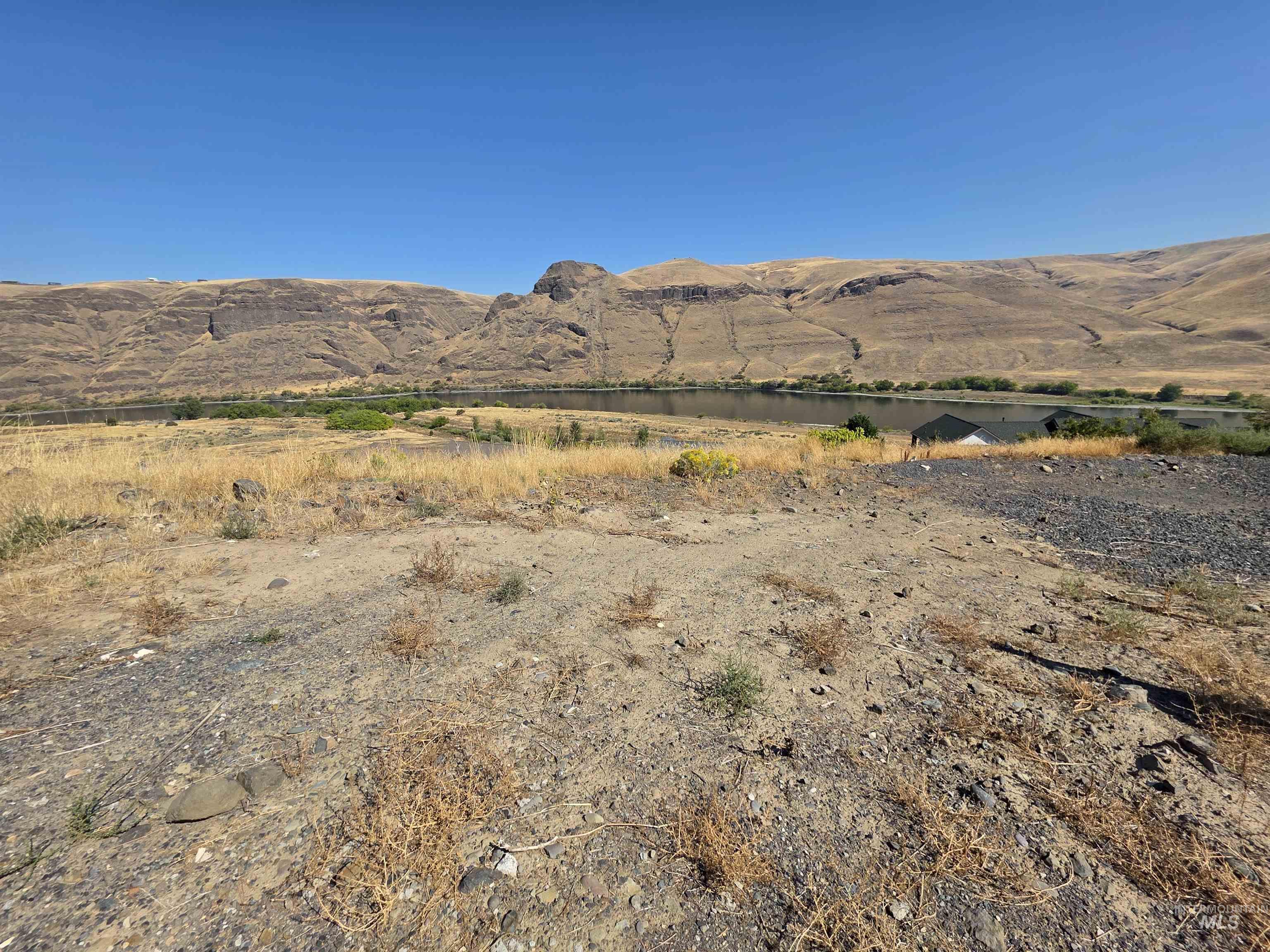 View of mountain backdrop with rural landscape