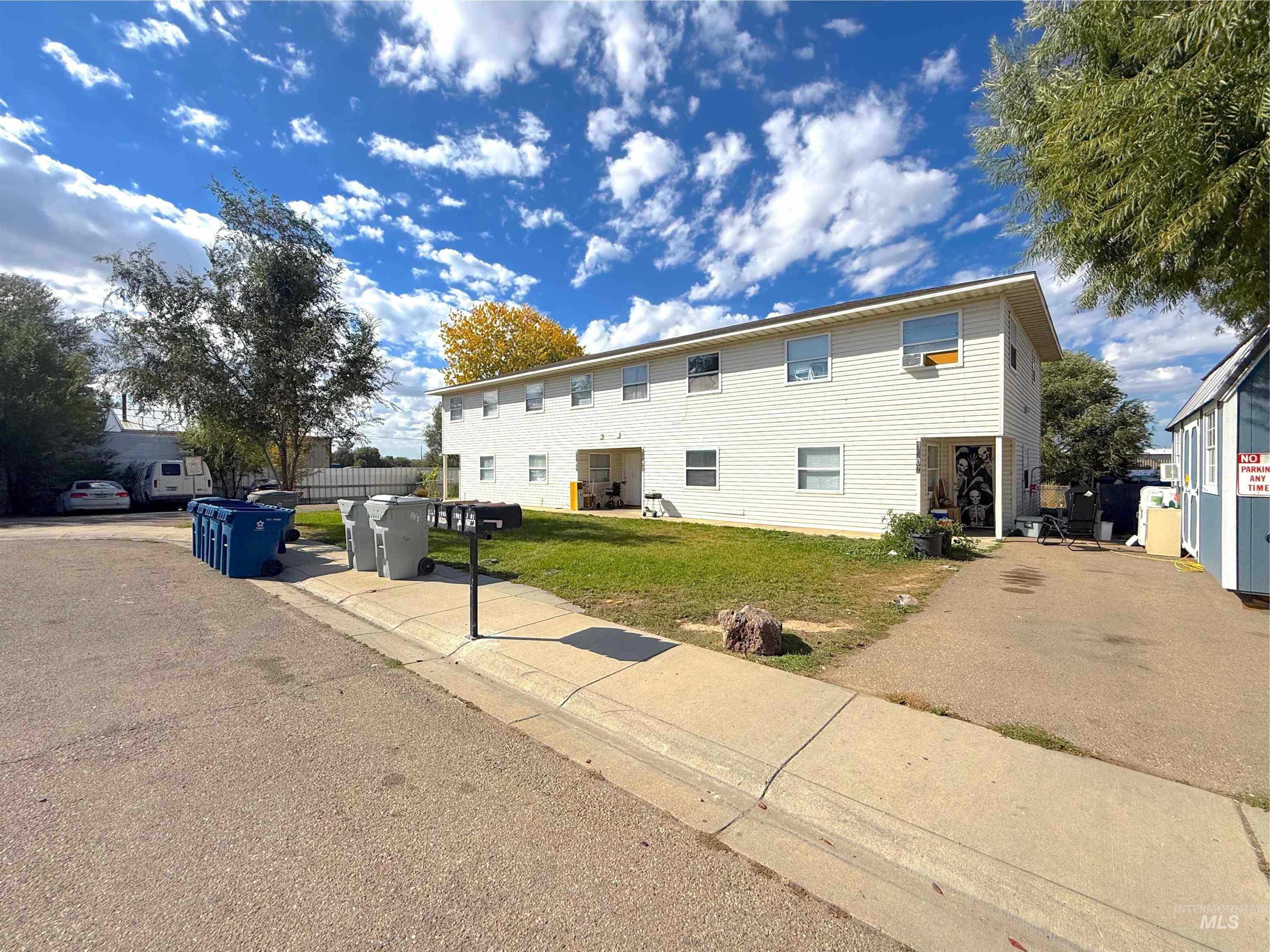 View of home's exterior with a yard