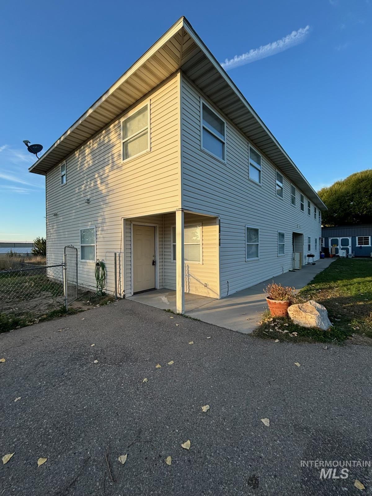 Rear view of property featuring a patio
