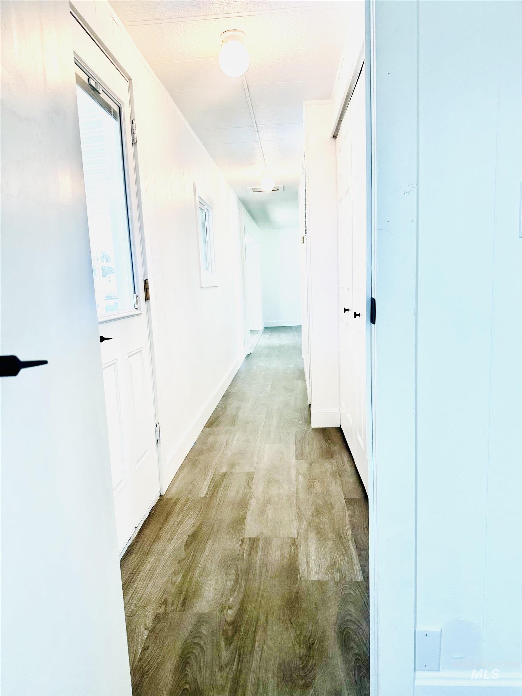 Hall with wood finished floors