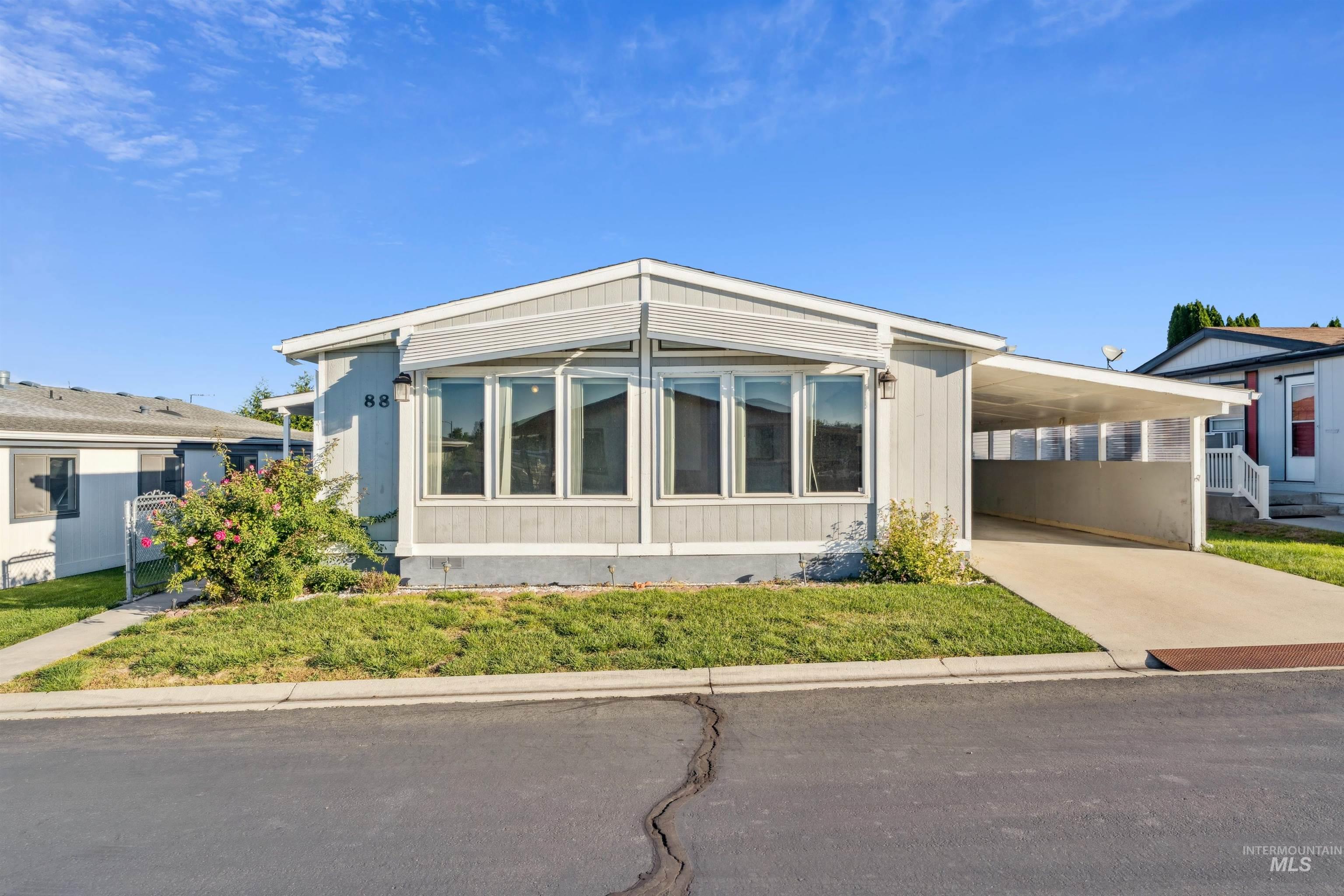 View of front of property featuring an attached carport