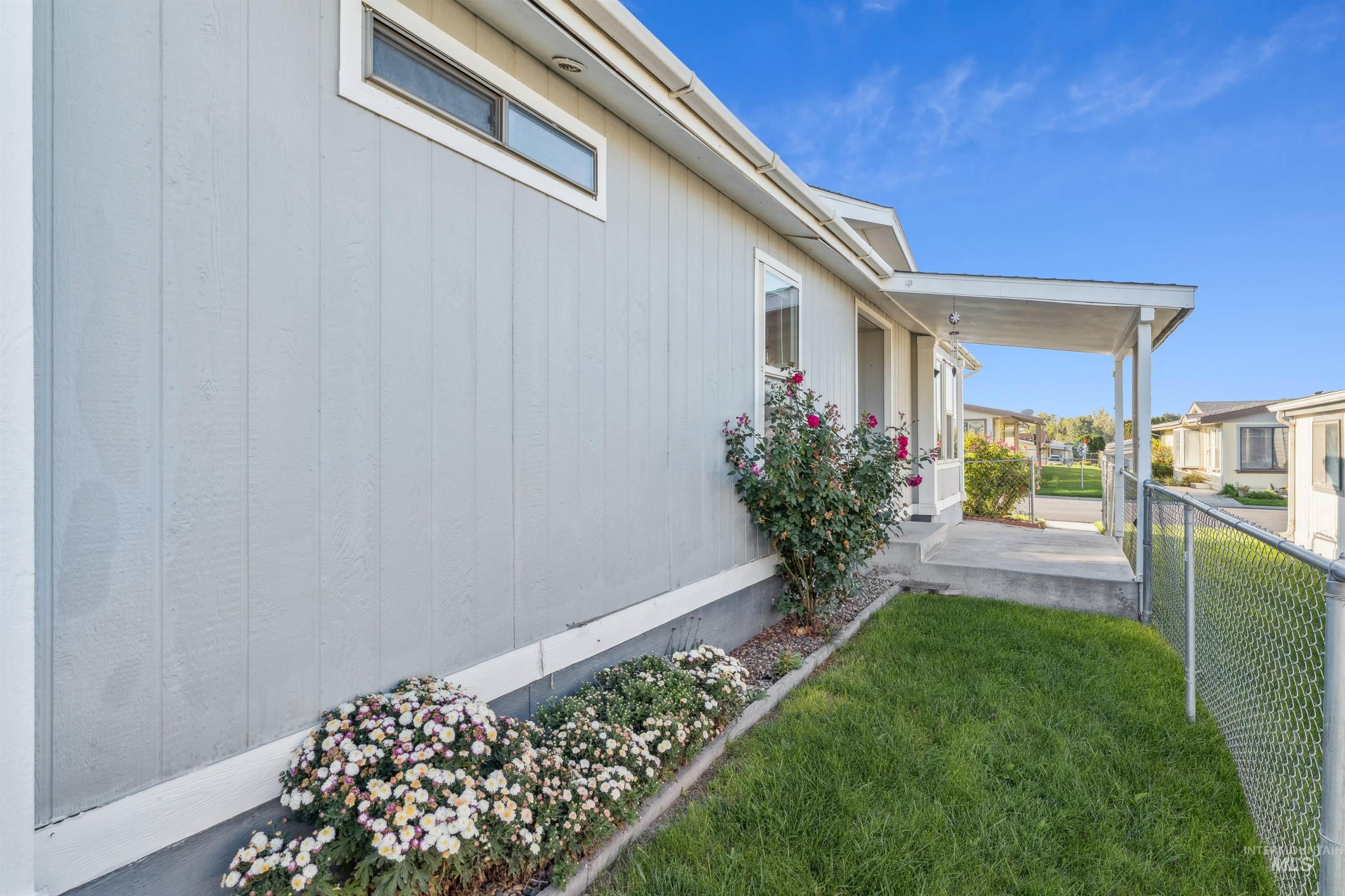 View of side of home featuring a porch