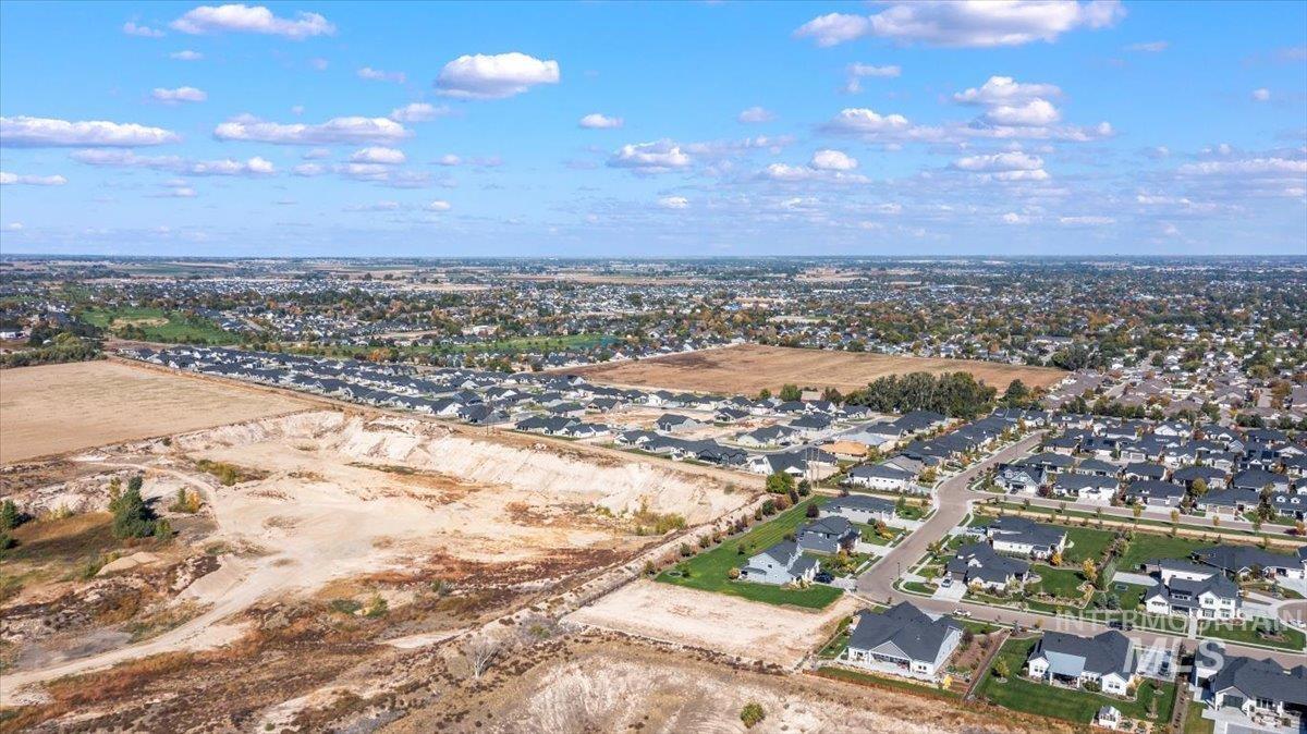 Aerial overview of property's location with nearby suburban area