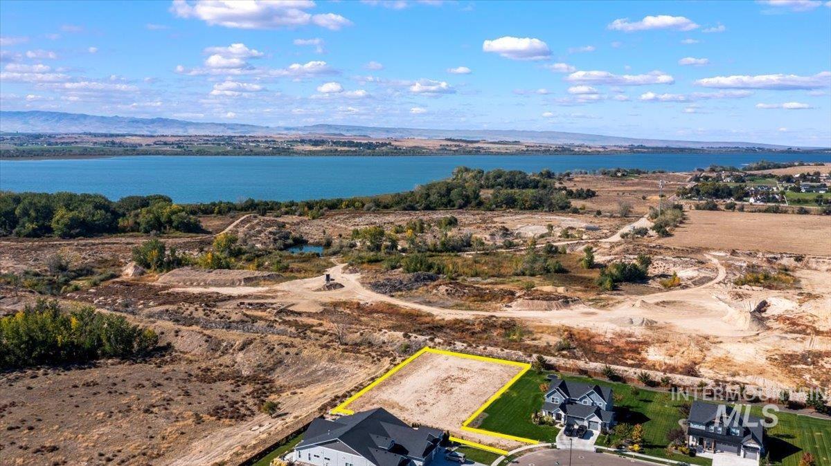 View of property location featuring property boundaries highlighted and a water and mountain view