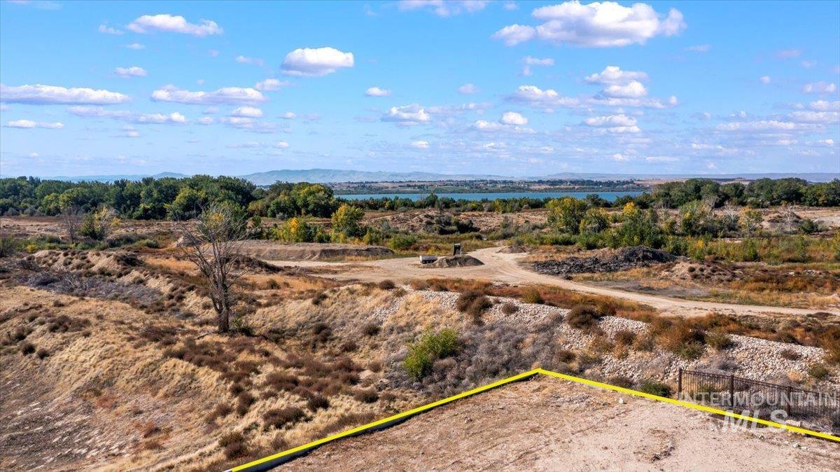 Aerial overview of property's location with property boundaries highlighted and a nearby body of water