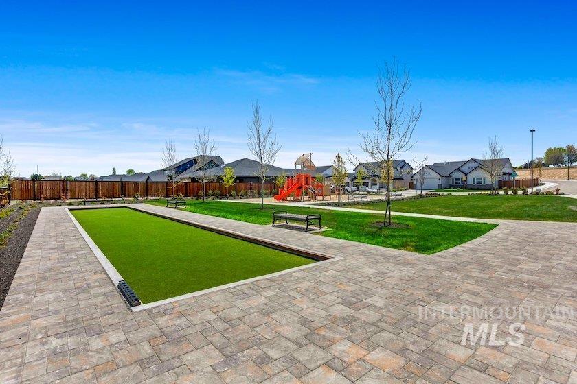 Surrounding community with a game area, a playground, and a residential view
