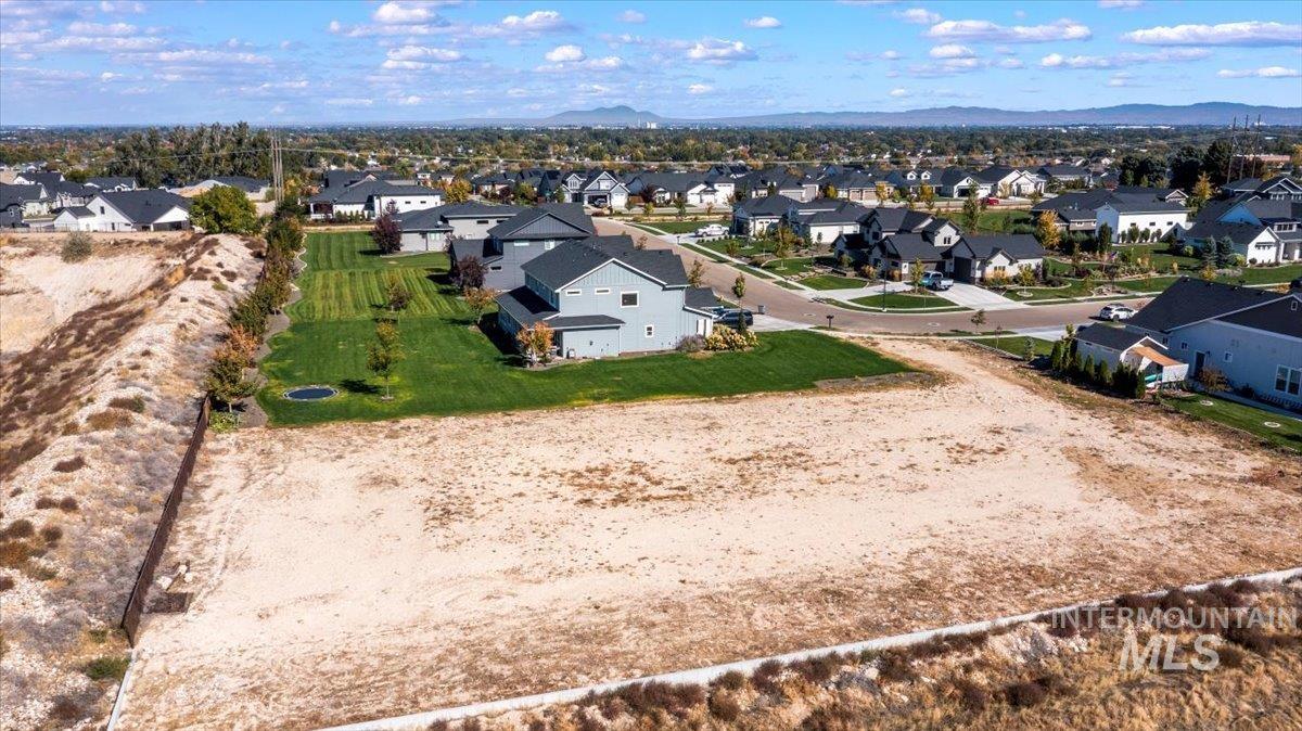 Aerial perspective of suburban area featuring mountains