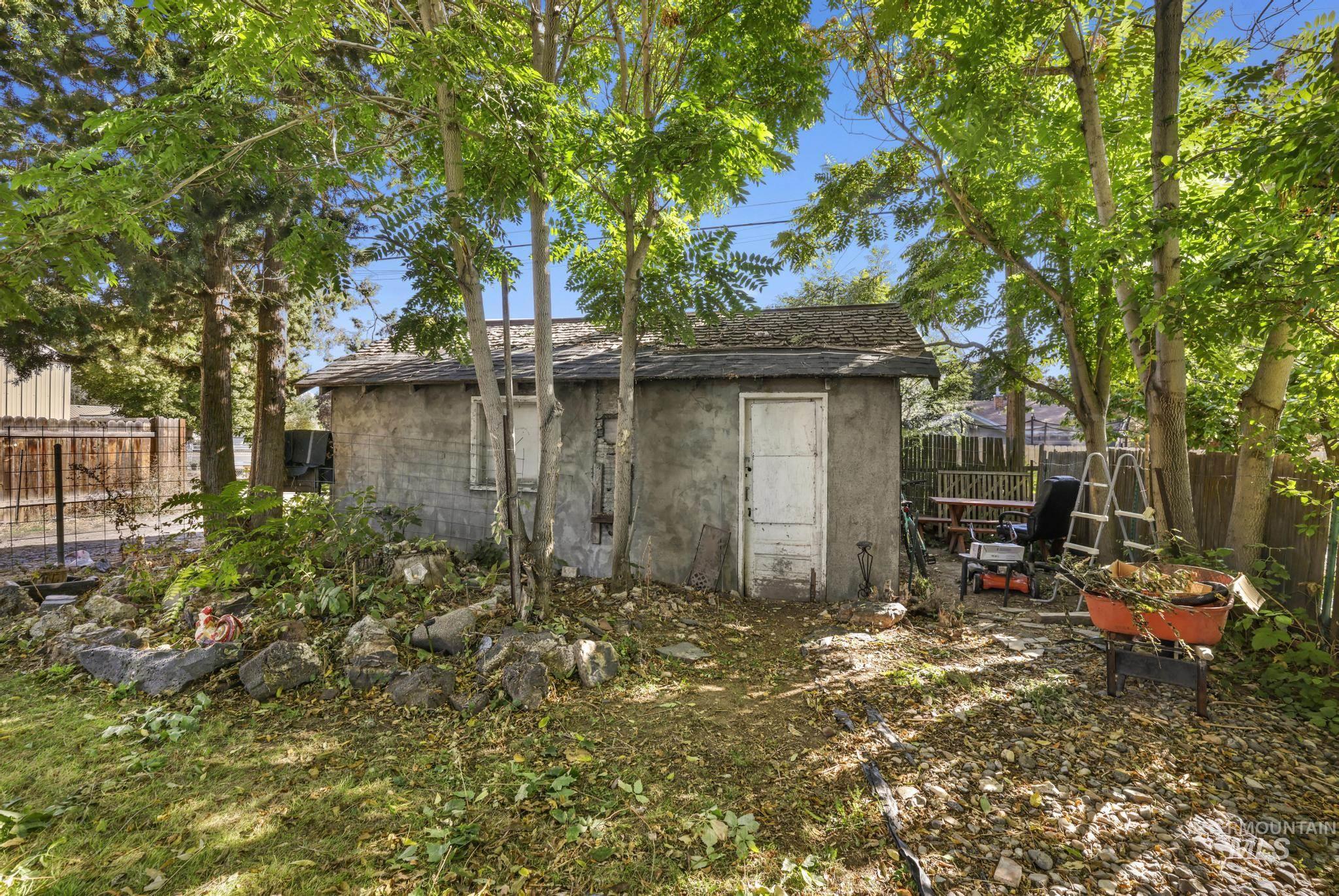 View of outbuilding with a fenced backyard