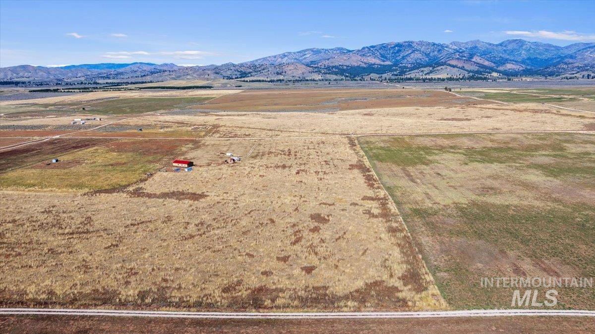 Aerial view of sparsely populated area featuring a mountain backdrop