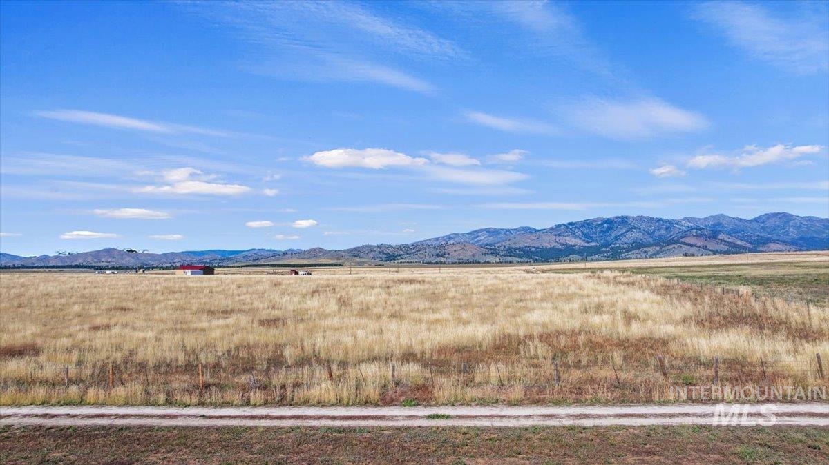 View of mountain background featuring rural landscape
