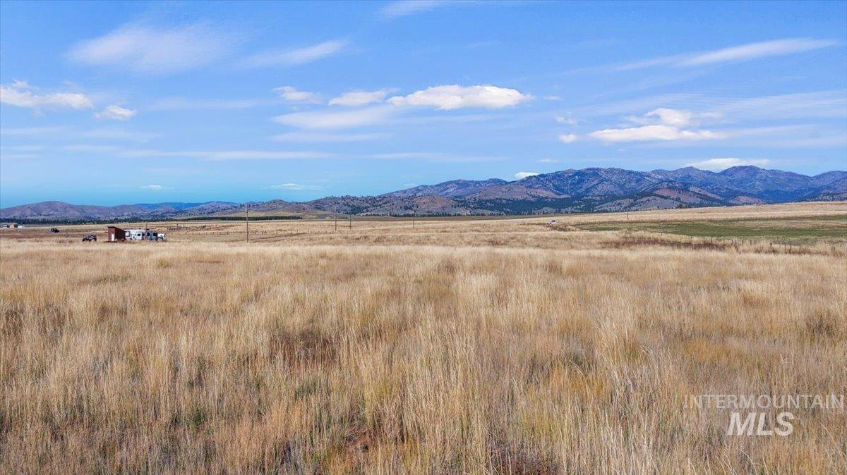 View of mountain background featuring rural landscape