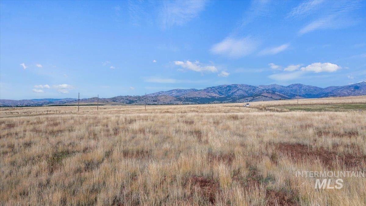 View of mountain background featuring rural landscape