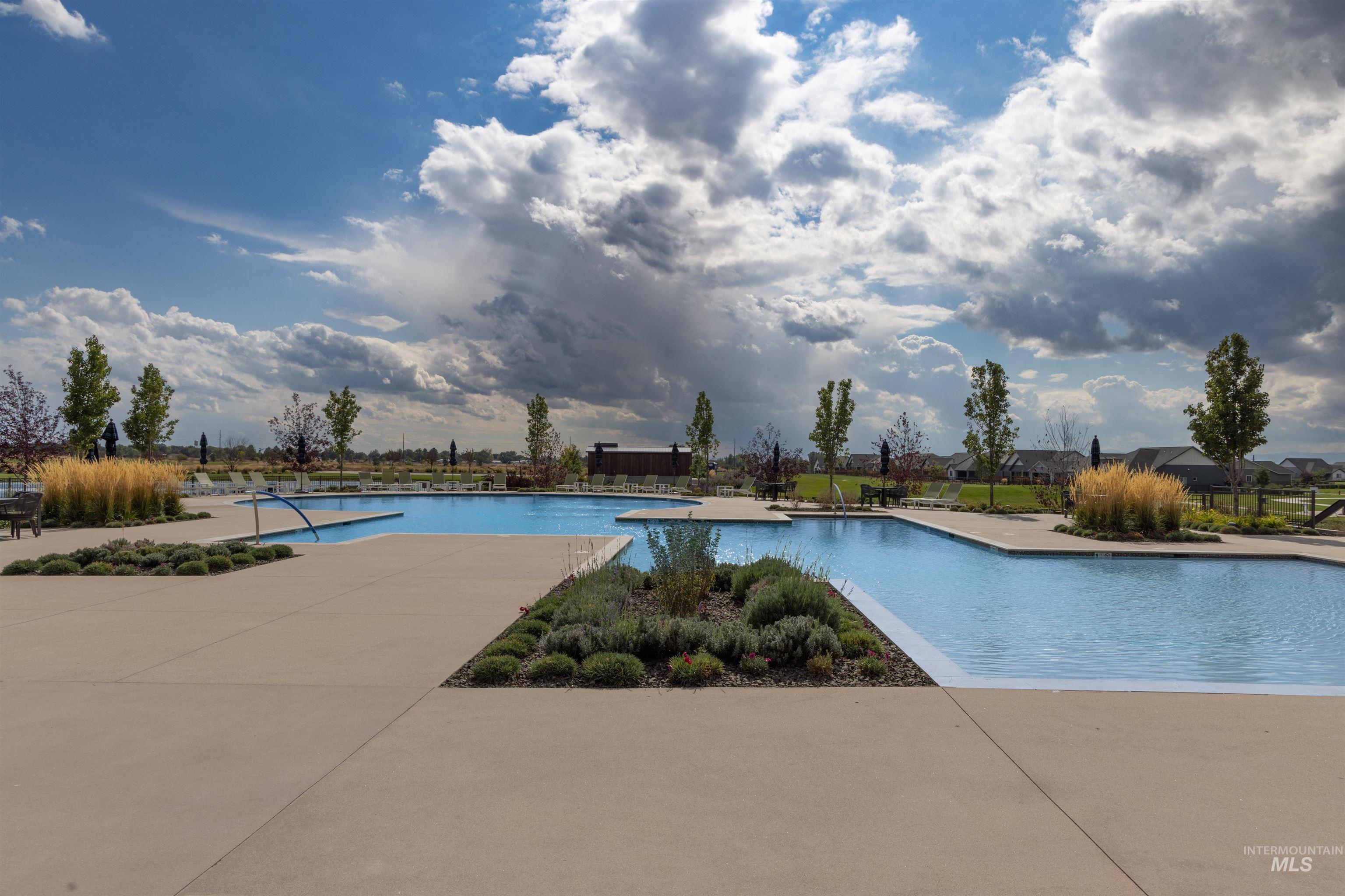 Community pool featuring a patio