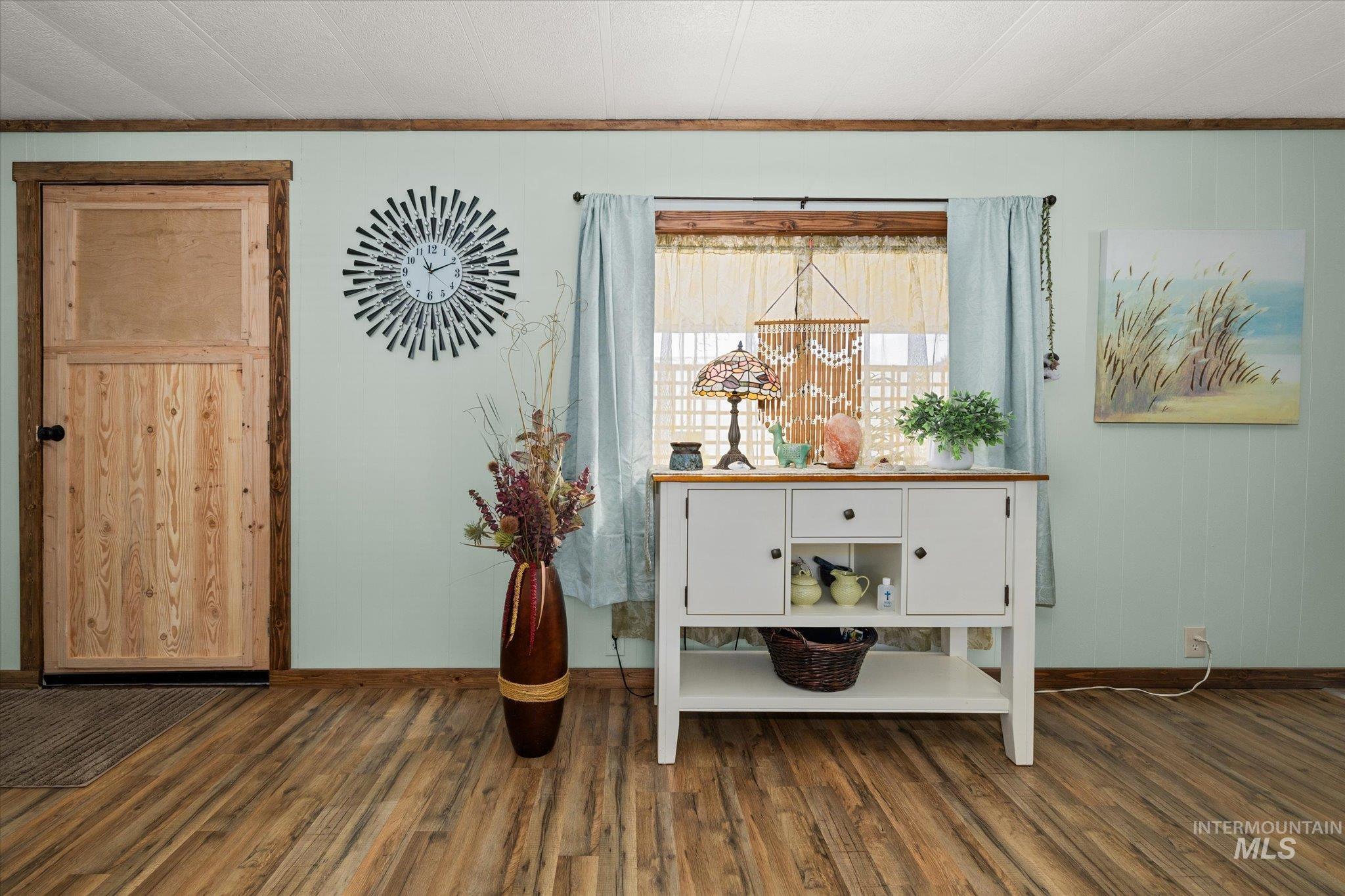 Detailed view of wood finished floors and crown molding